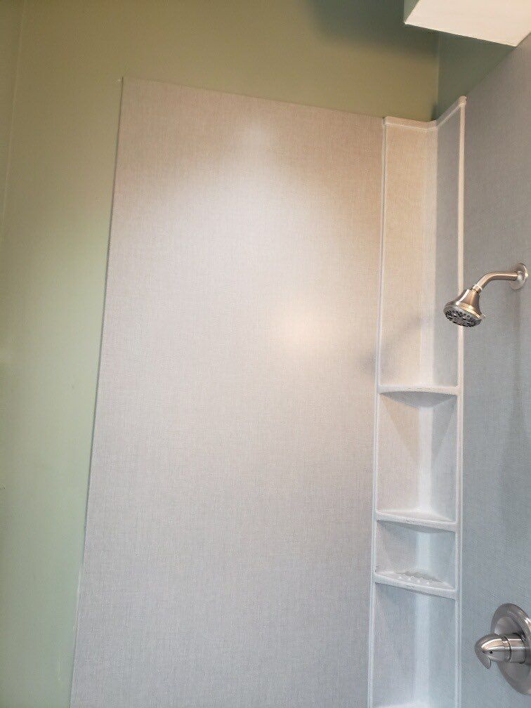 Bathroom Remodel using BCI Acrylic Shower System by Secure Construction Company Inc