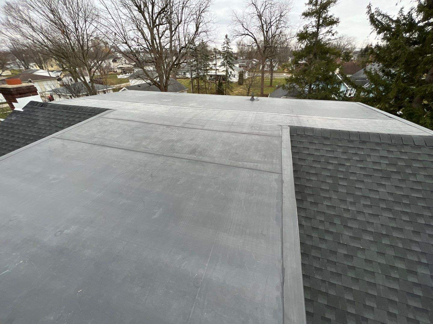 Residential Roofing Installation using 60 mil rubber roof by Nitro Roofing and Construction