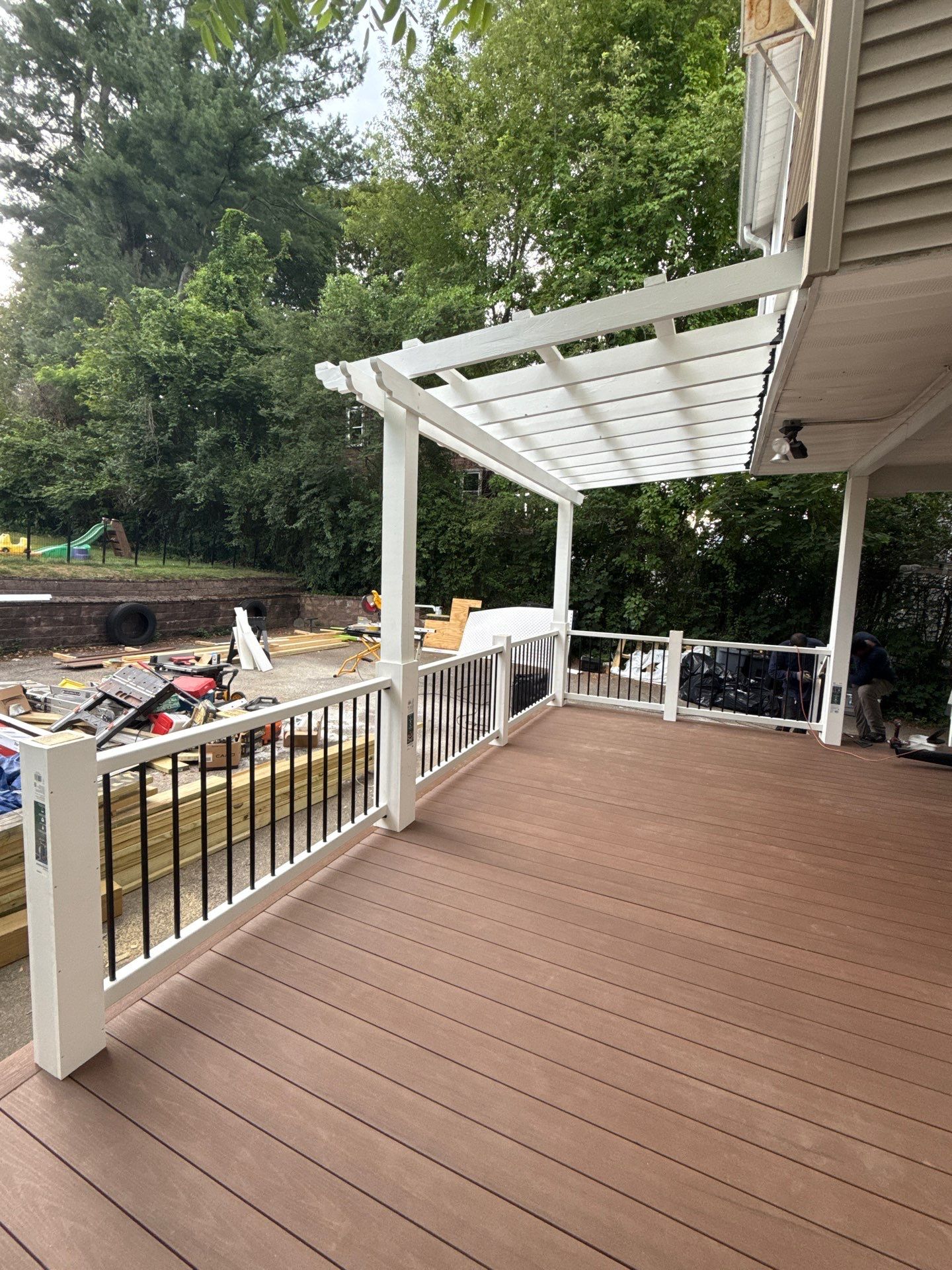 new deck with custom pergola by CabralCarpentry & Painting LLC