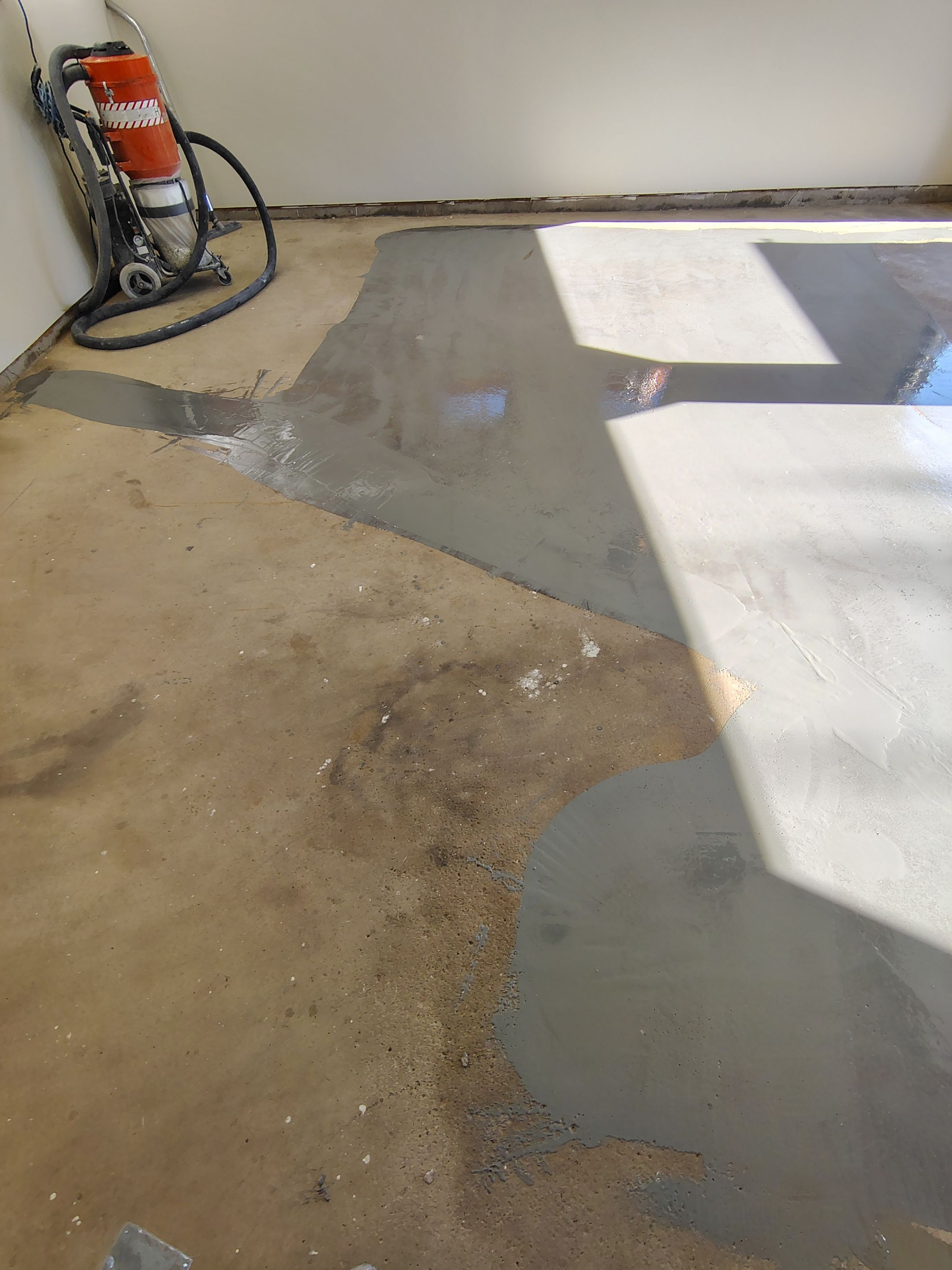 Full-Flake Epoxy Garage Floor Coating Installation in Sioux Falls by Select Painting, Coatings & Garage Cabinets
