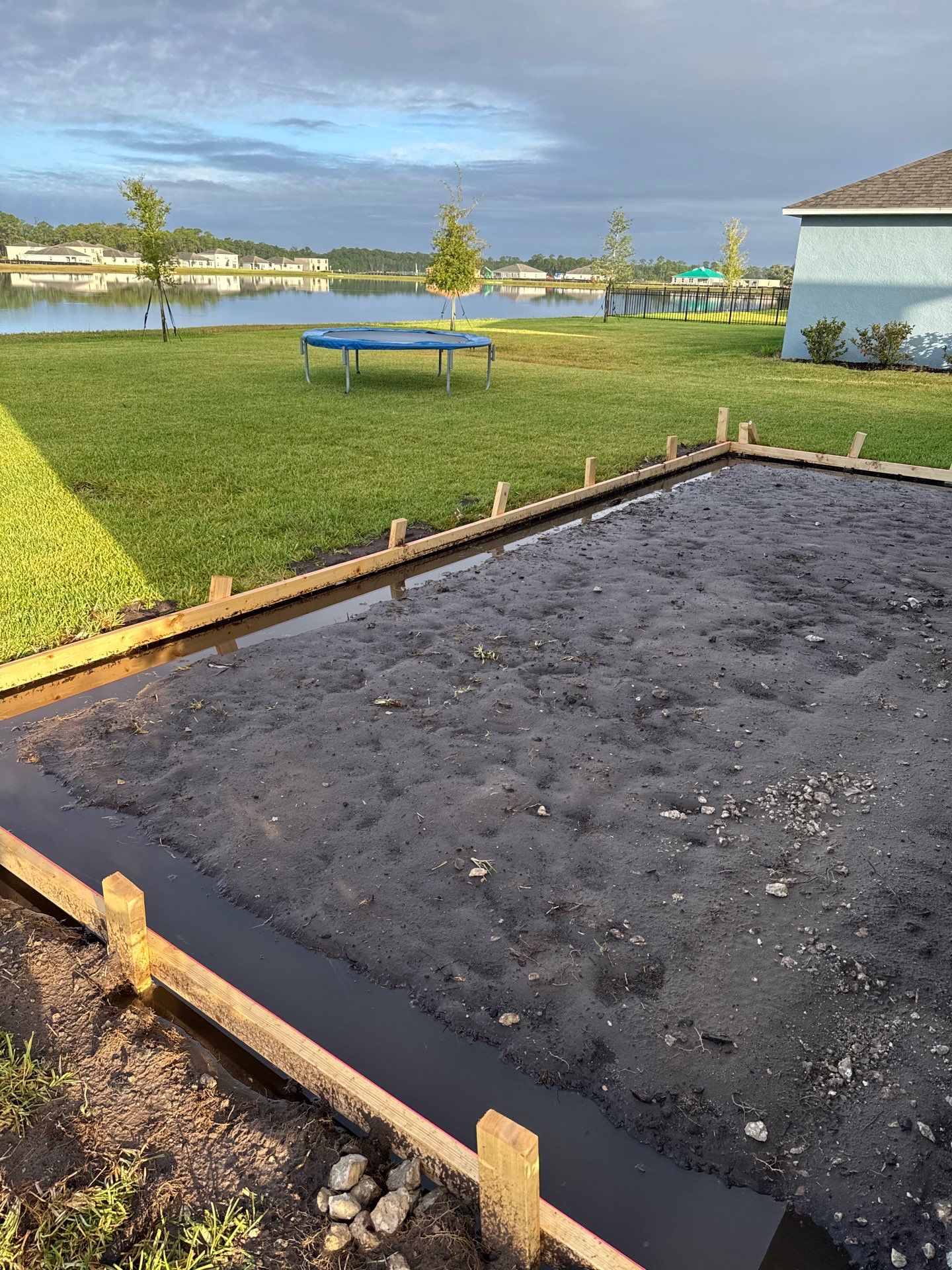 New concrete pad by Courtesy screening