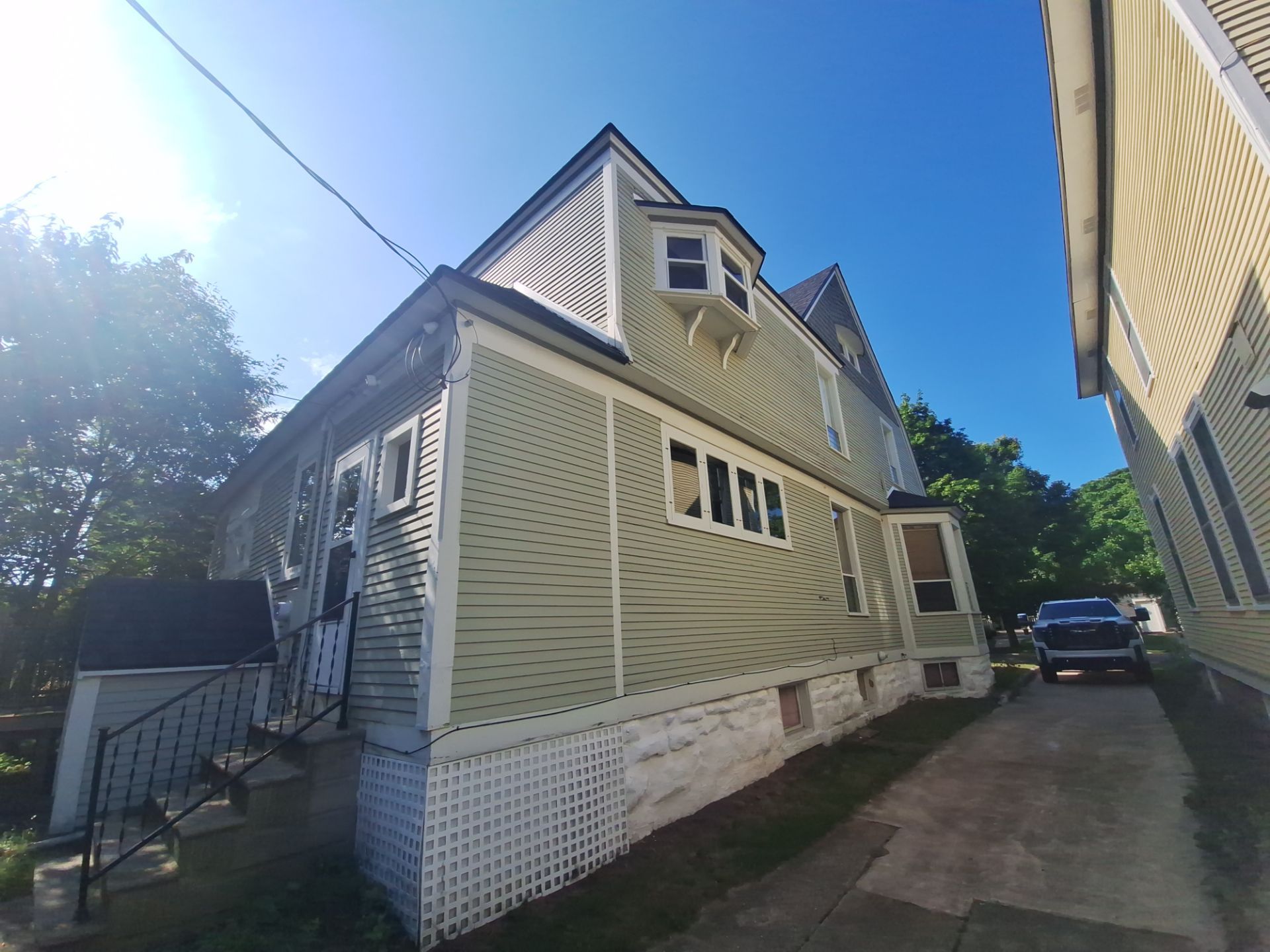 Exterior Home & Porch Refresh in Grand Haven, MI by Gordon Painting