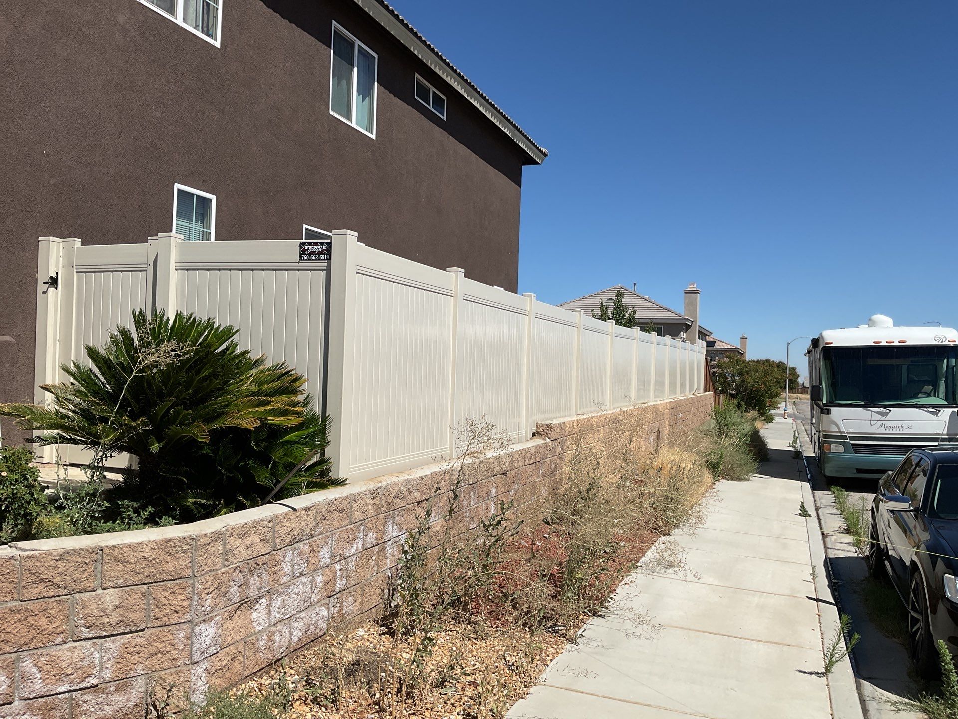 Tan Vinyl by Fence Guys Inc. 
