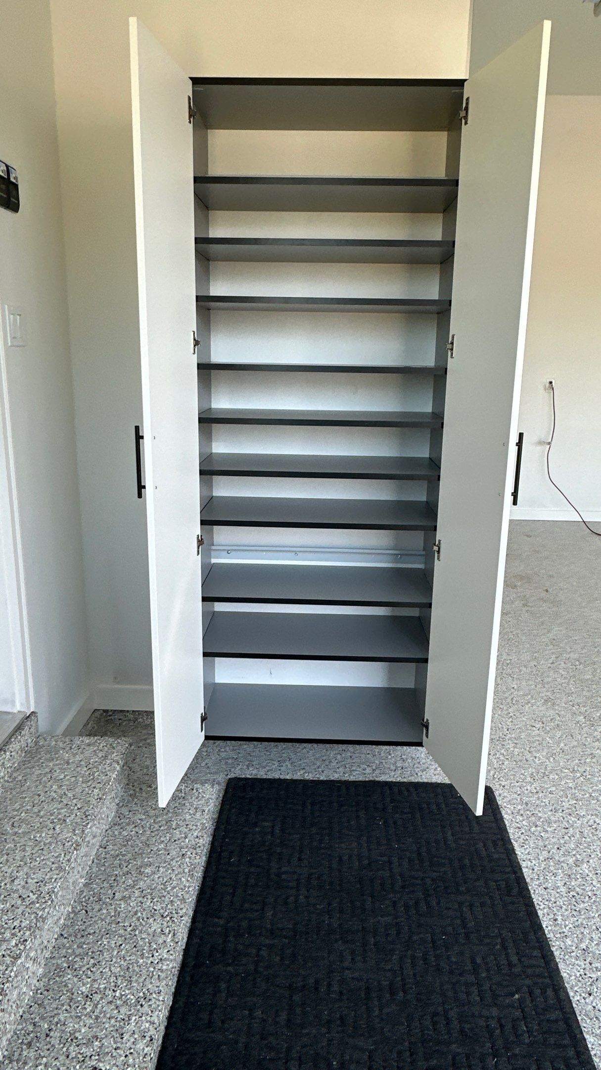 Jon S. transformed his garage with a new floor, slotwall & Cabinets! by Banner Garage
