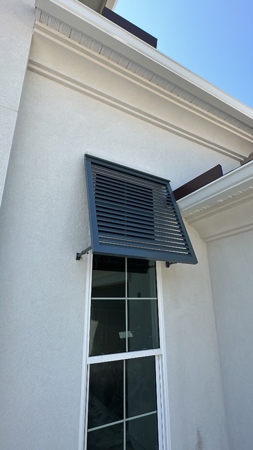 Bahama Shutters in Blue Grey  by Smart Guard Shutters