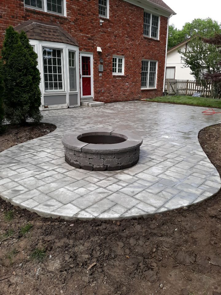Back Yard Stamped Patio by LAND ESCAPES LLC