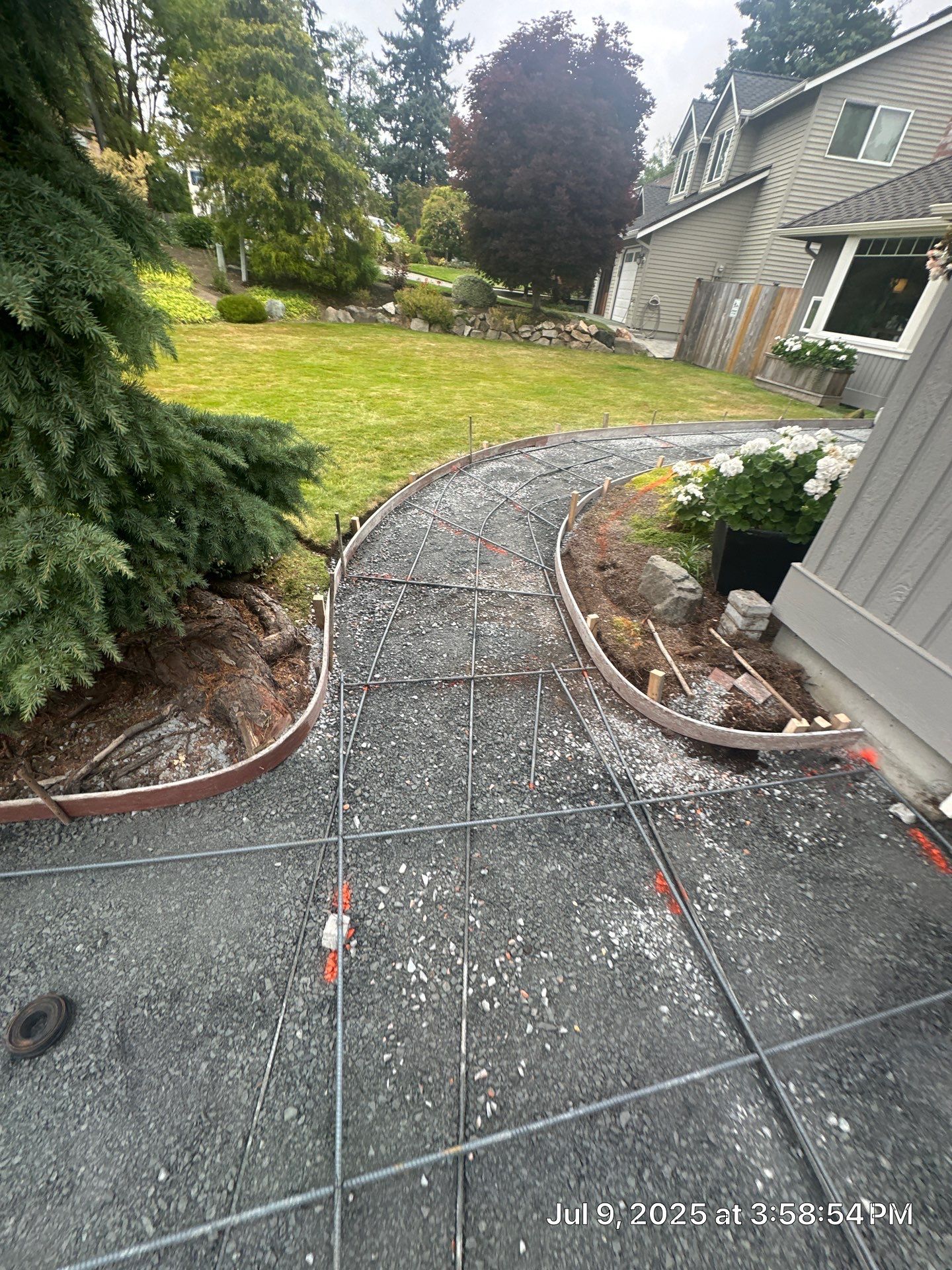 Exposed Aggregate Concrete Driveway Makeover  by Jireh Asphalt & Concrete Inc 