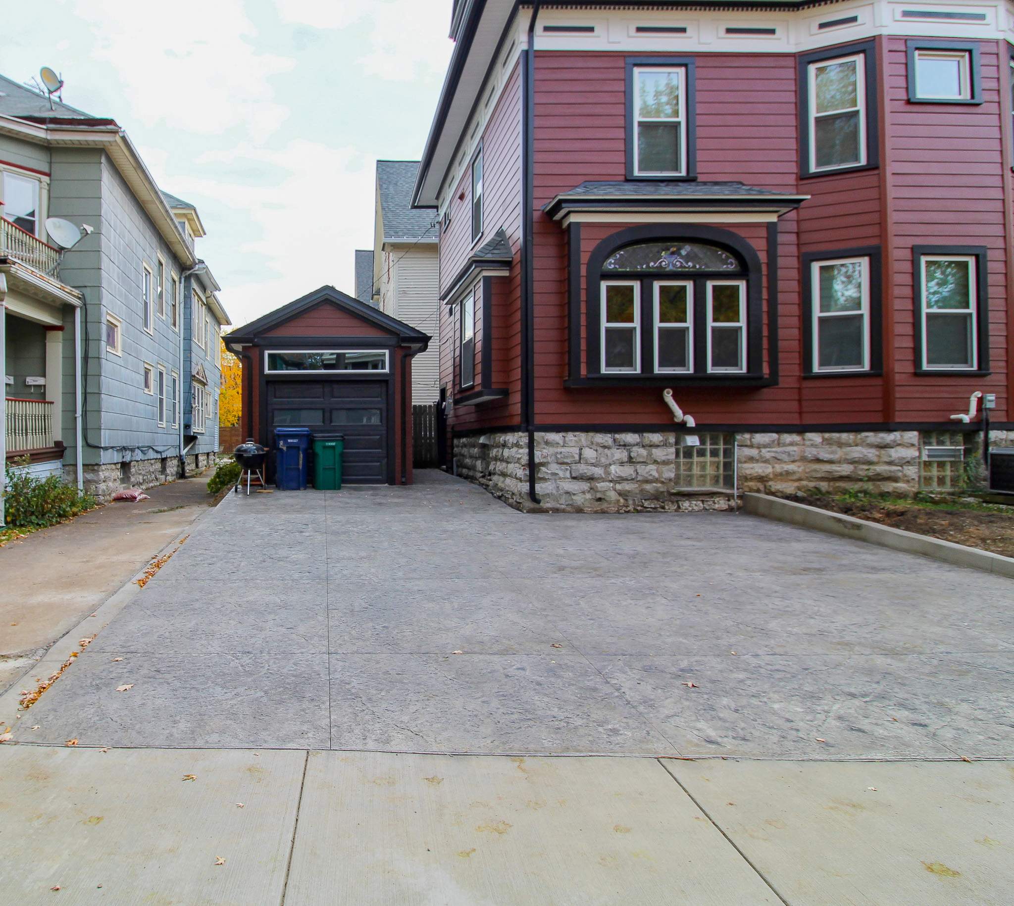 Exterior Renovations- Siding, Stamped Concrete, Porch, and Railings by Ivy Lea Construction