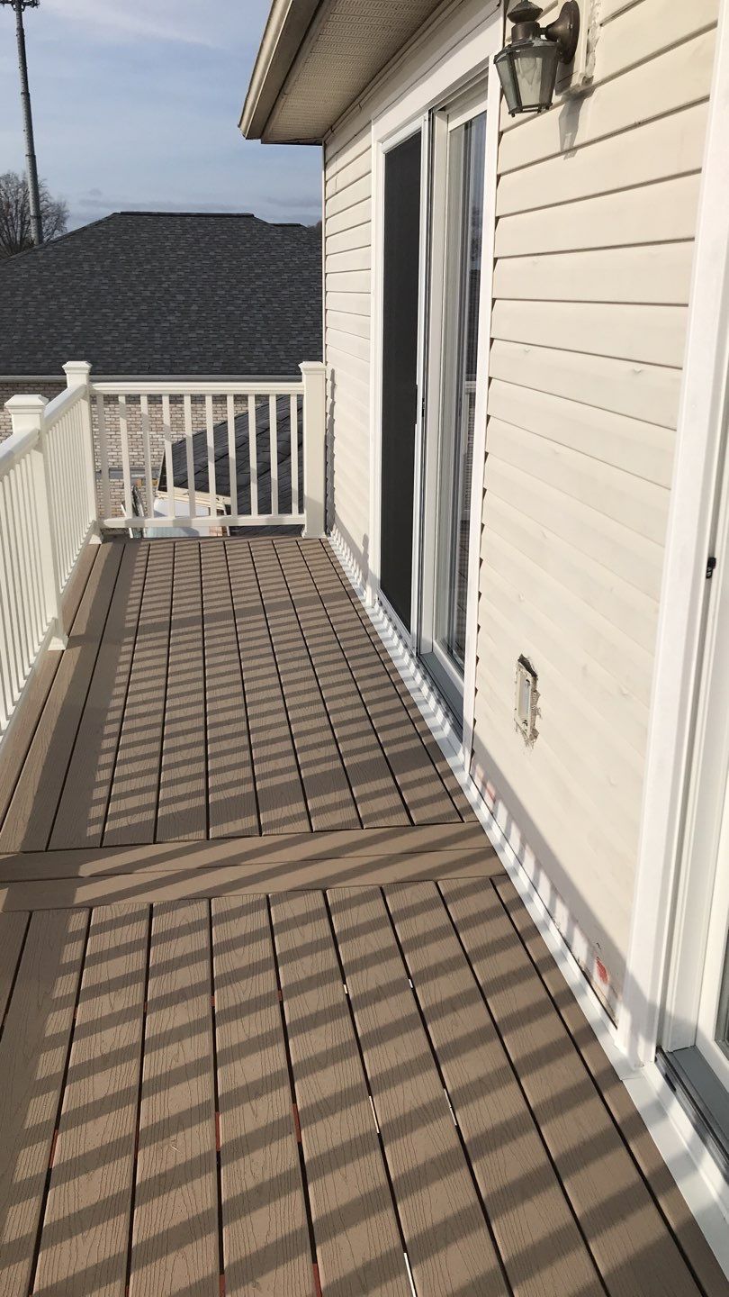 Deck Refurbush and Door Replacement using Trex Decking and Railing. Polaris Patio Doors by Secure Construction Company Inc