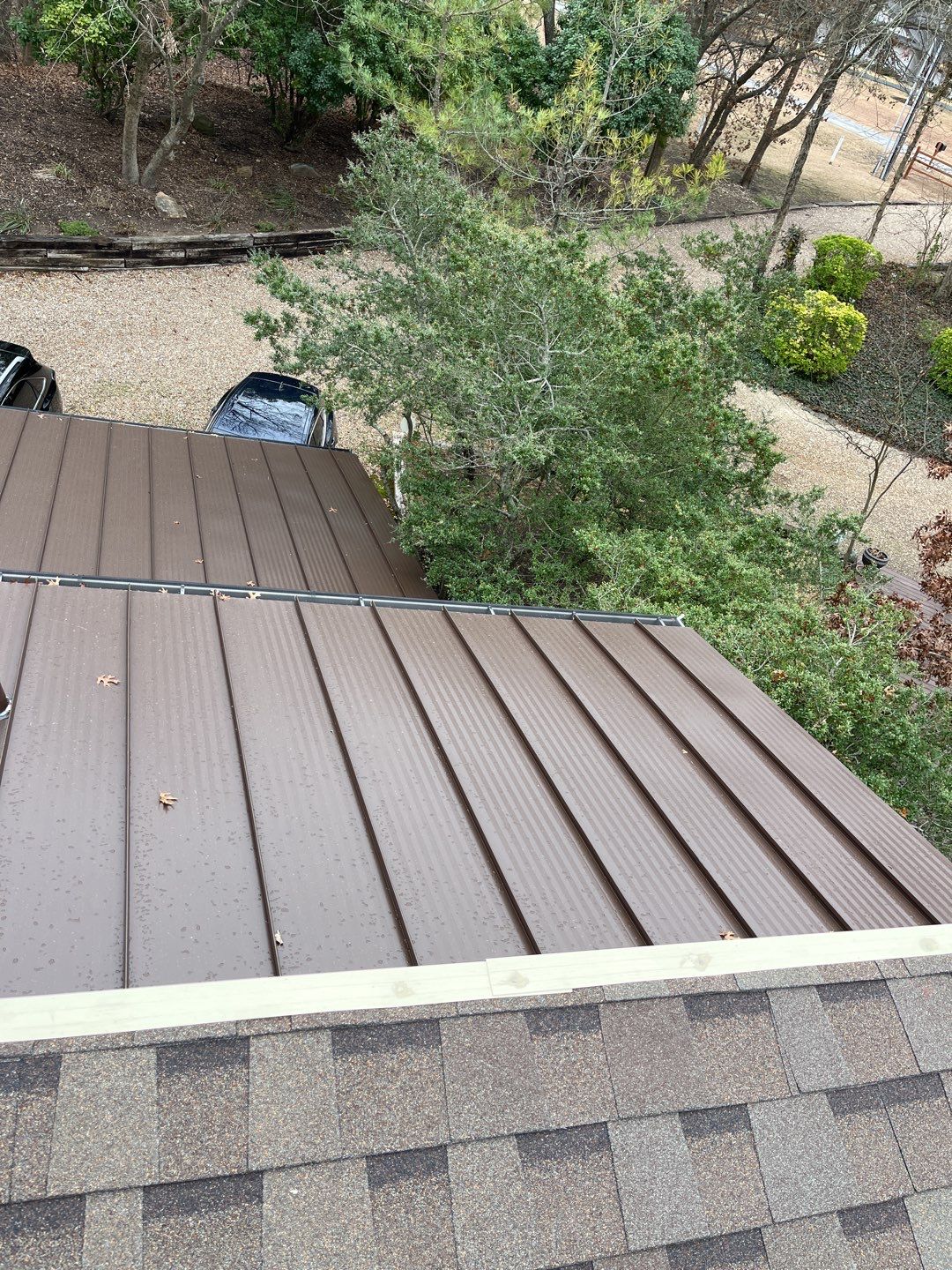 Residential Roofing Installation using Standing Seam Metal Roofing and Composition Shingles by Rainy Day Restoration