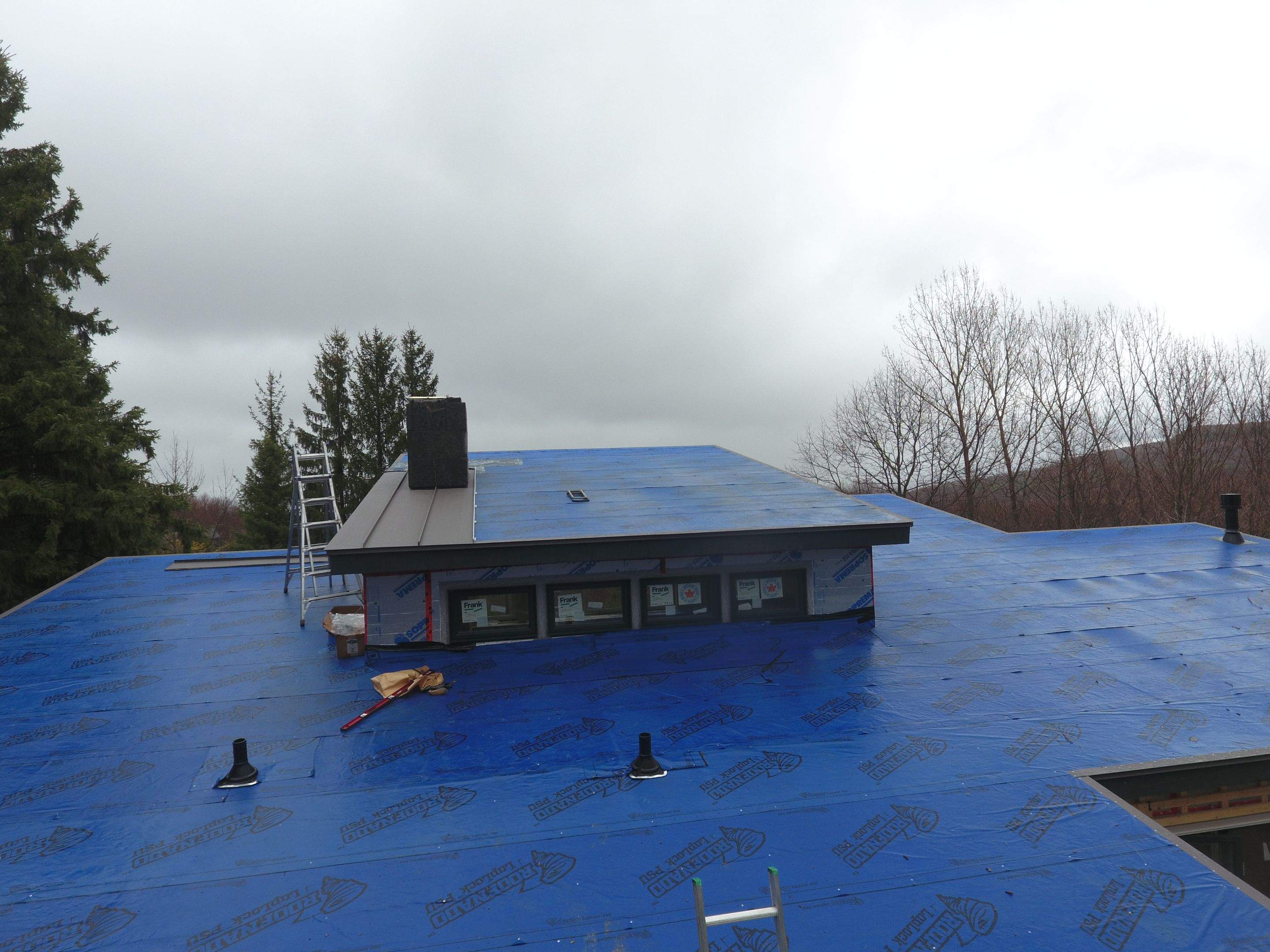Residential Roofing Installation using 24 Ga Standing Seam Metal by Jay Carter Roofing & Sheet Metal