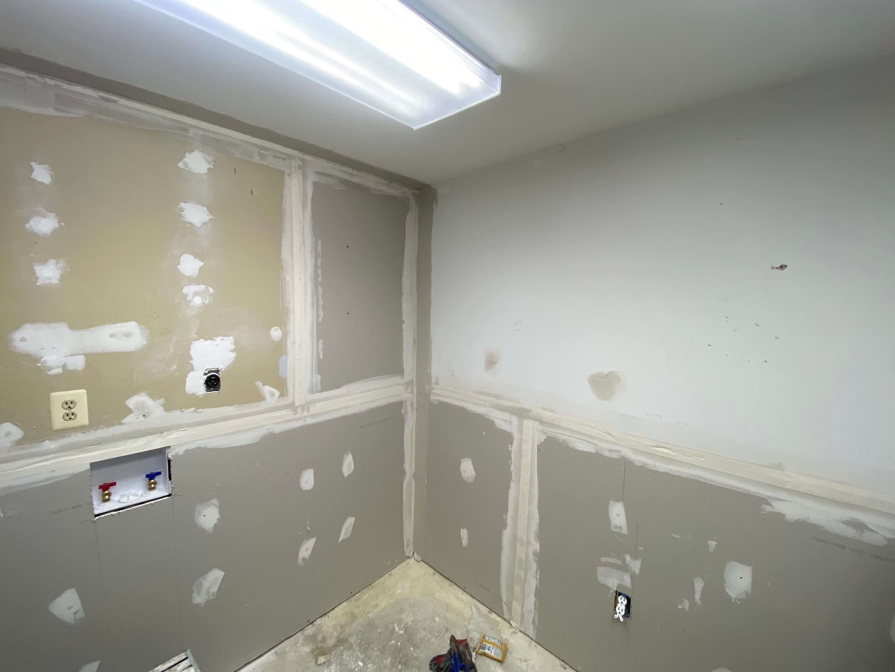 Laundry Room Redmodel using Lifeproof Luxury Vinyl Plank Flooring by The Smet Companies, LLC