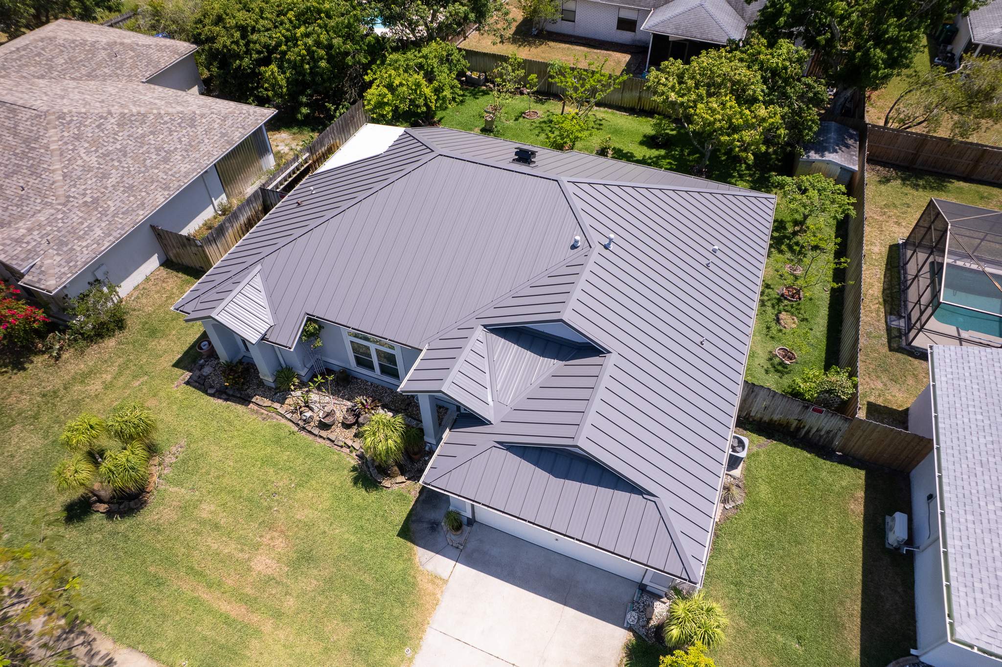 Complete Metal Roof Replacement and Seamless Gutter Installation in Melbourne by Wiedmann Construction & Roofing