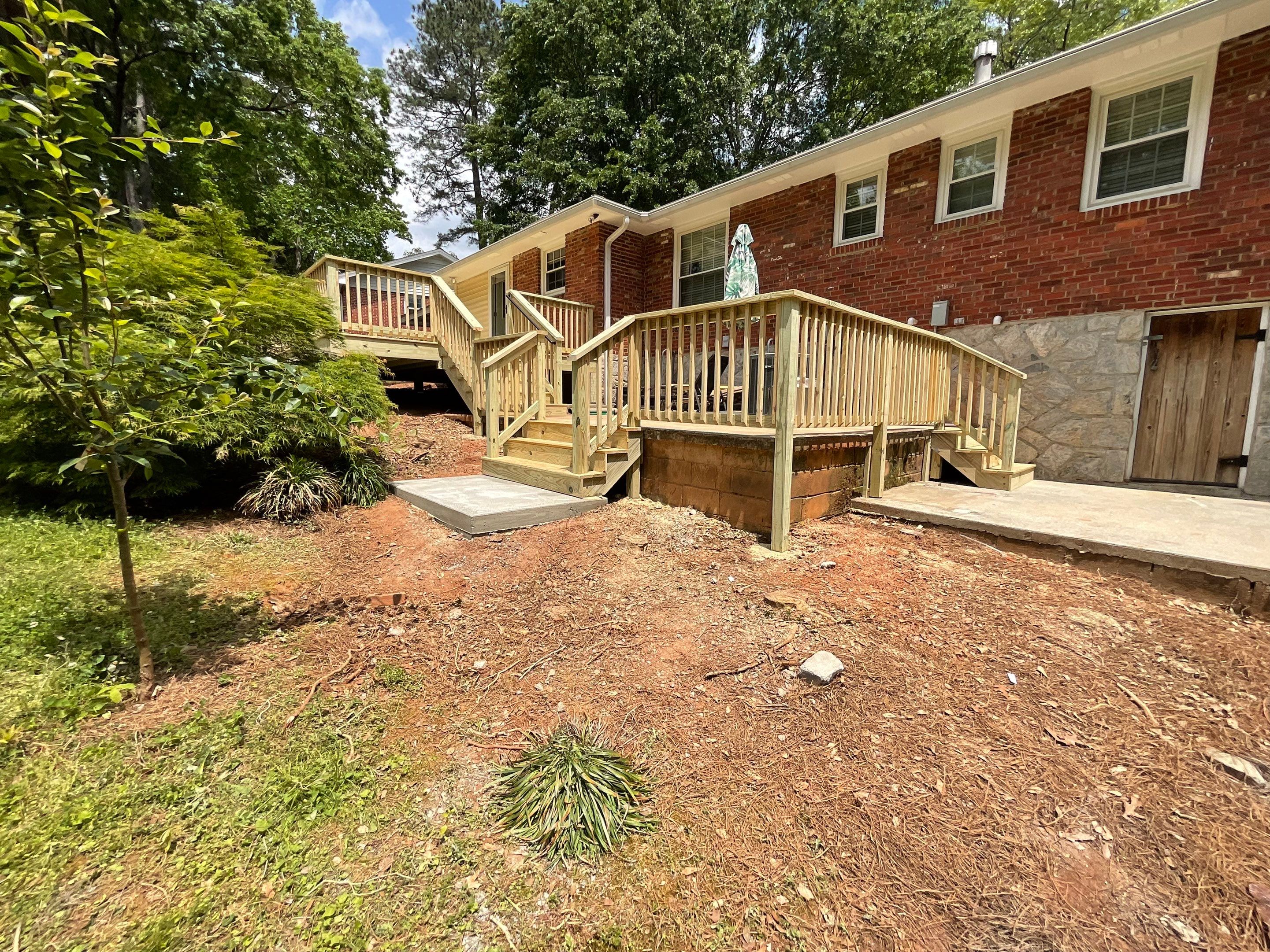 Custom Pressure-Treated Wood Deck and Railing Installation in Decatur by Swift Home Renovations