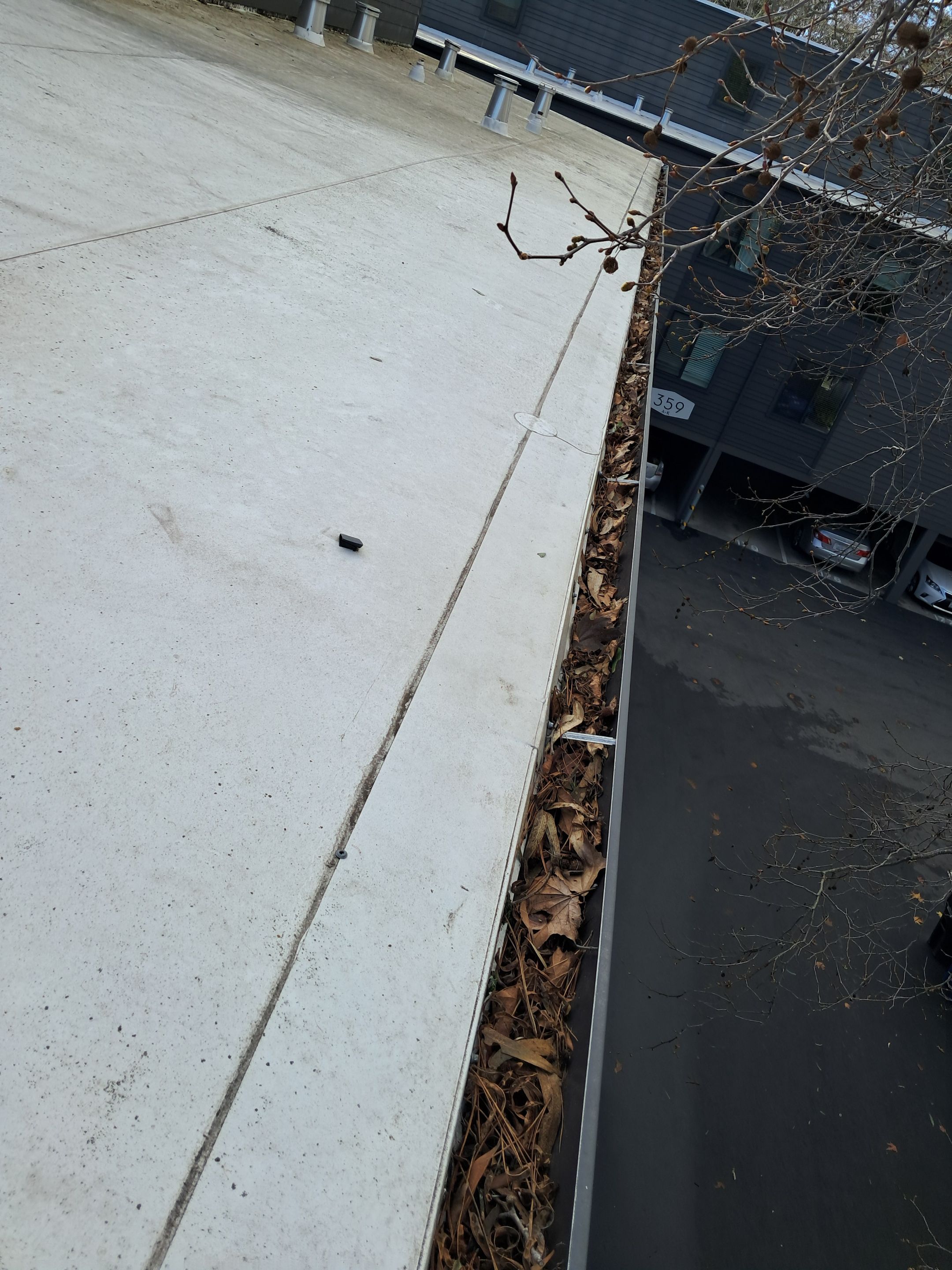 HOA gutter cleaning in Santa Cruz ,before photo showing full gutters.