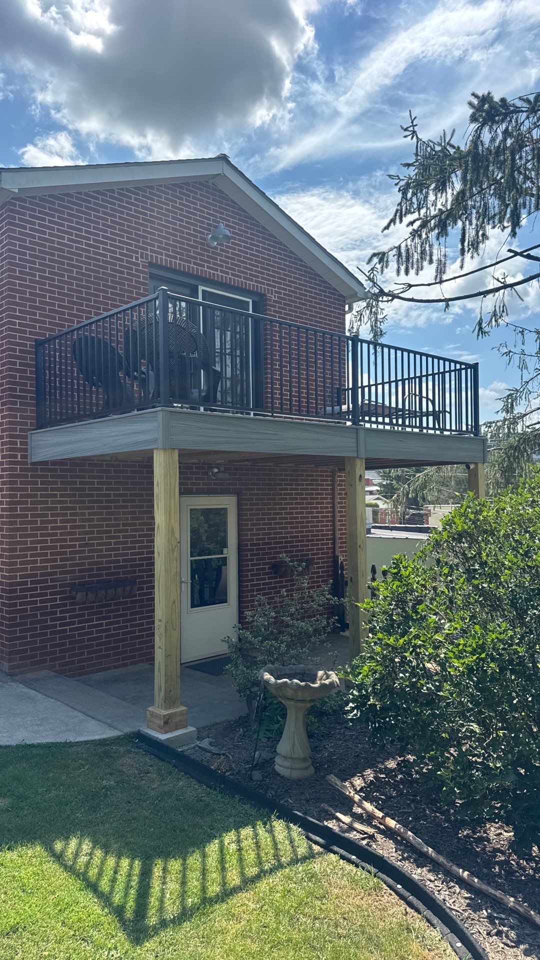 Elevated Composite Deck Rebuild with Black Metal Railing in Lewisburg by Walnut Hollow Decks & Outdoor Living