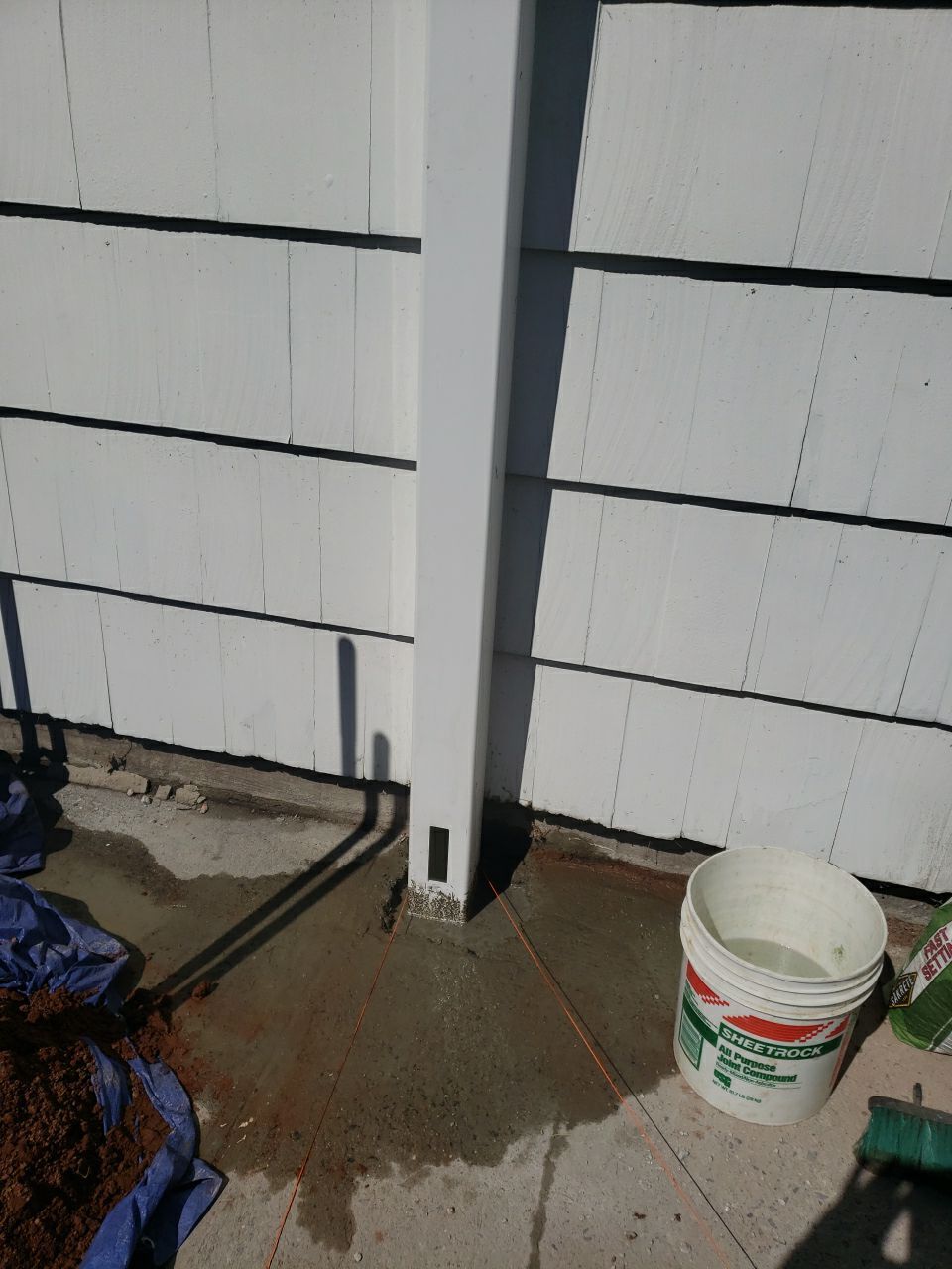 New Vinyl privacy fence with double gate. In two tone gray and white coloring. by DiGiorgi Roofing and Siding Inc
