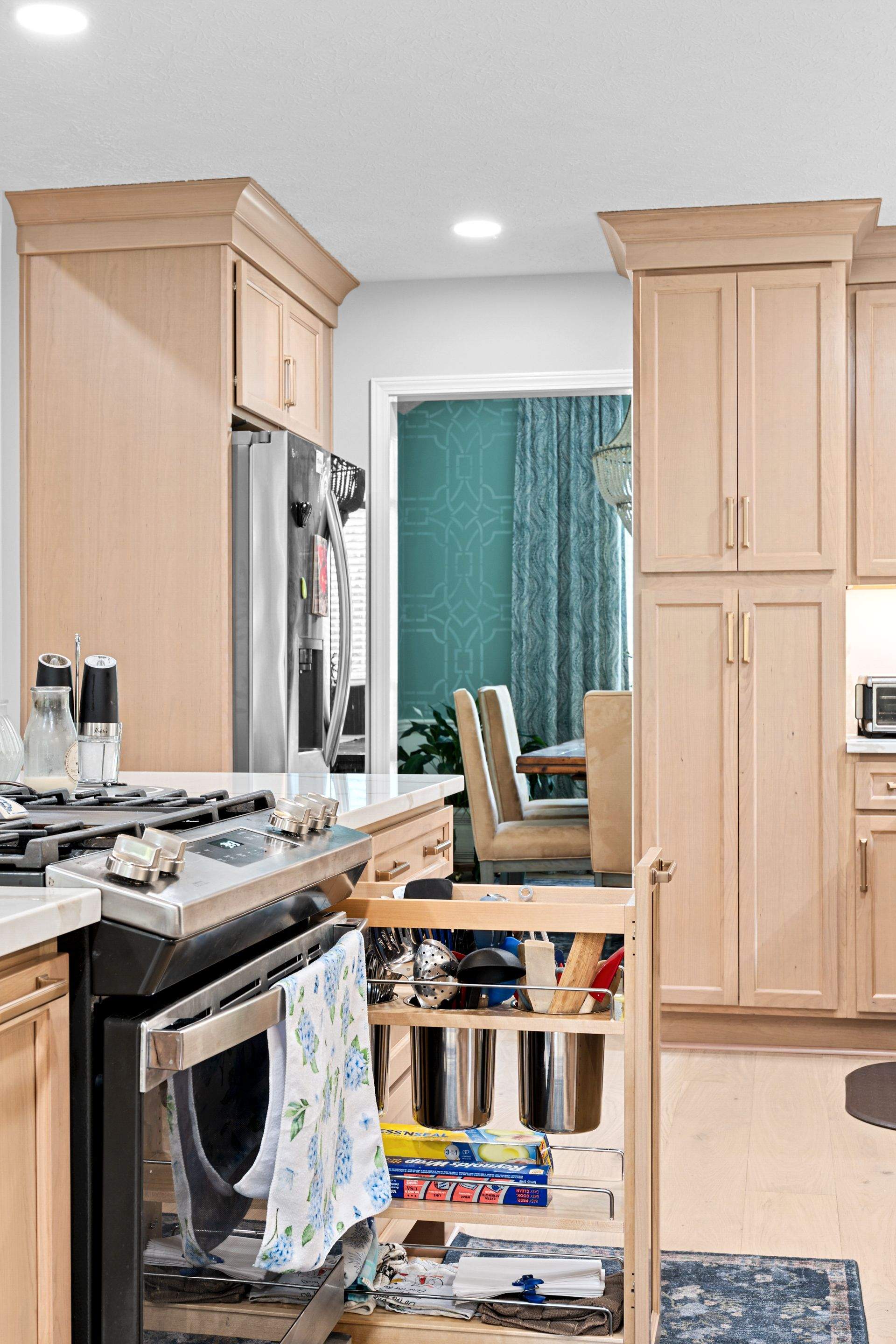 Modern Kitchen Remodel Featuring Quartz Backsplash, under cabinet lighintg, and a coffee bar in Mt. Juliet Tennessee by DeRo Renovations,LLC