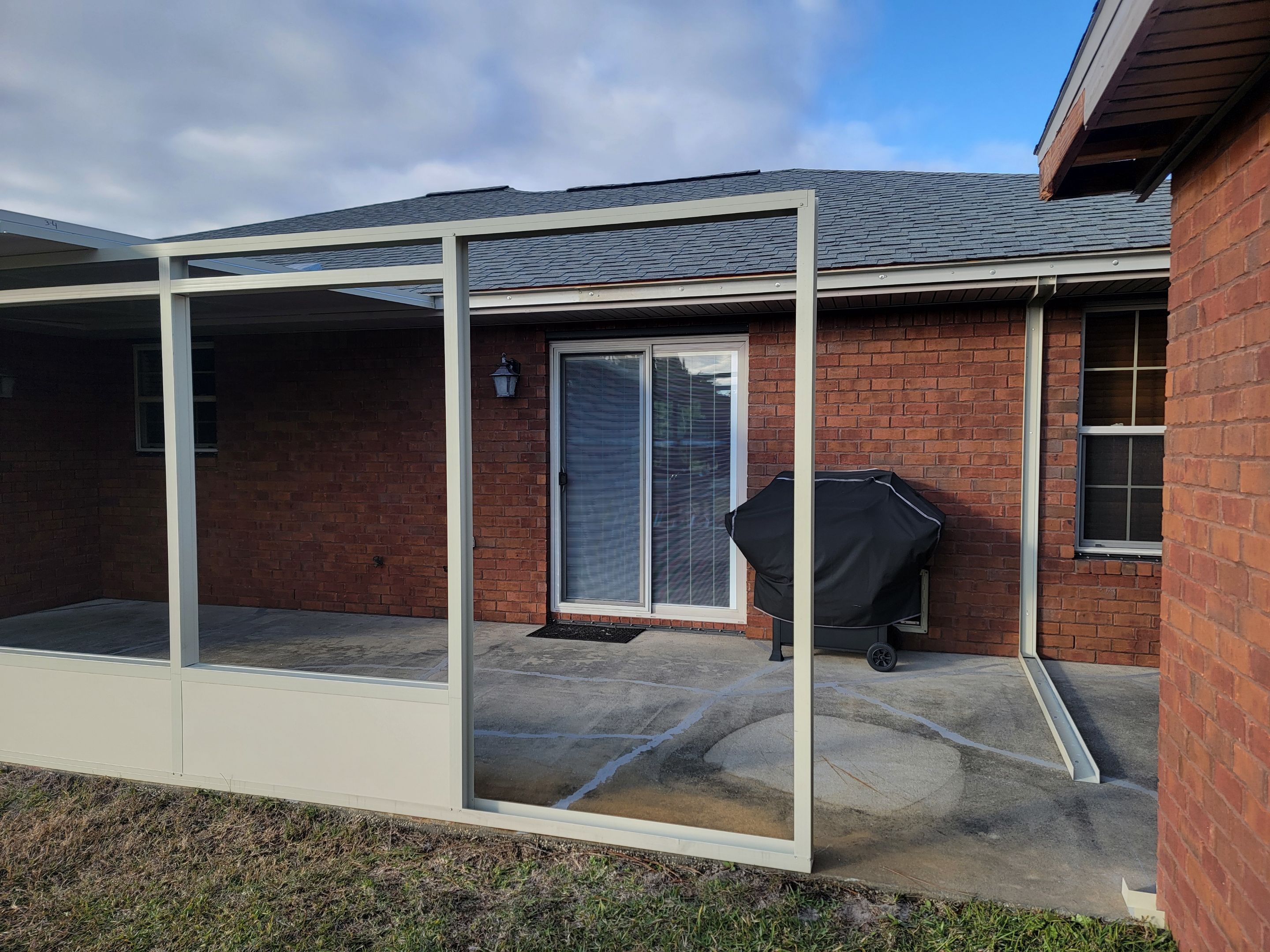 Enclosure w/Vinyl Windows using Colorbeam by Titan Sunrooms