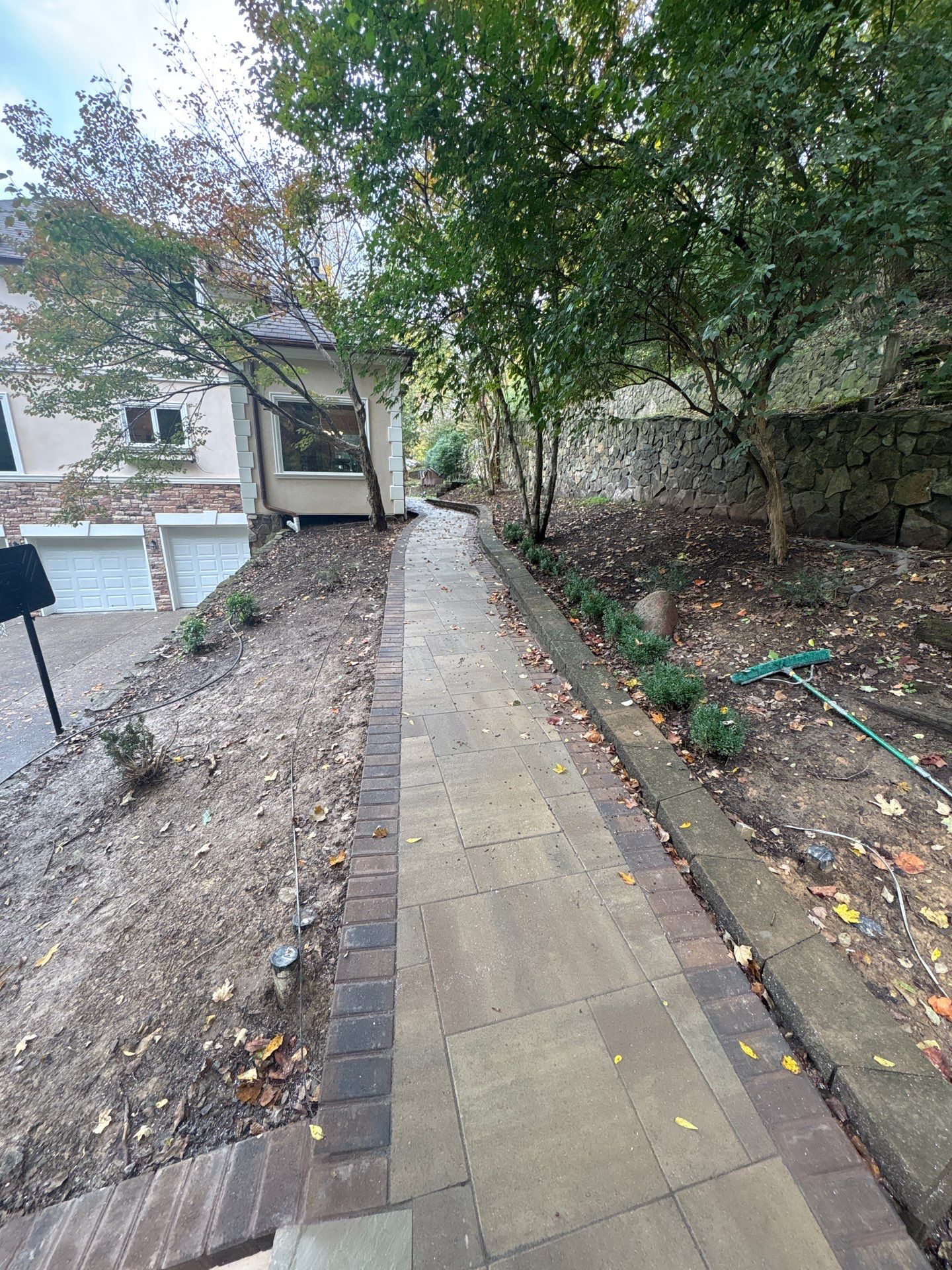 Franklin Exterior Remodel Featuring Custom Stucco and Stone Hardscaping by U.S. Exterior Solutions