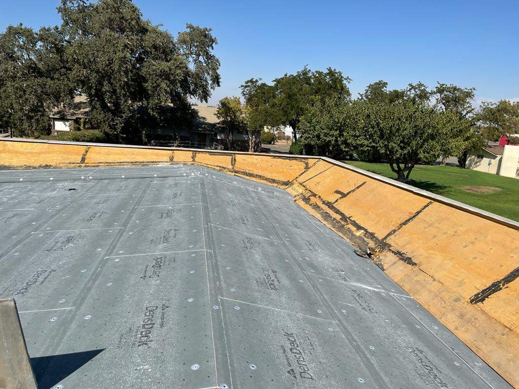 Commercial Roofing Installation using General Coatings acrylic coatings and spray foam by Straight Edge Roofing Inc