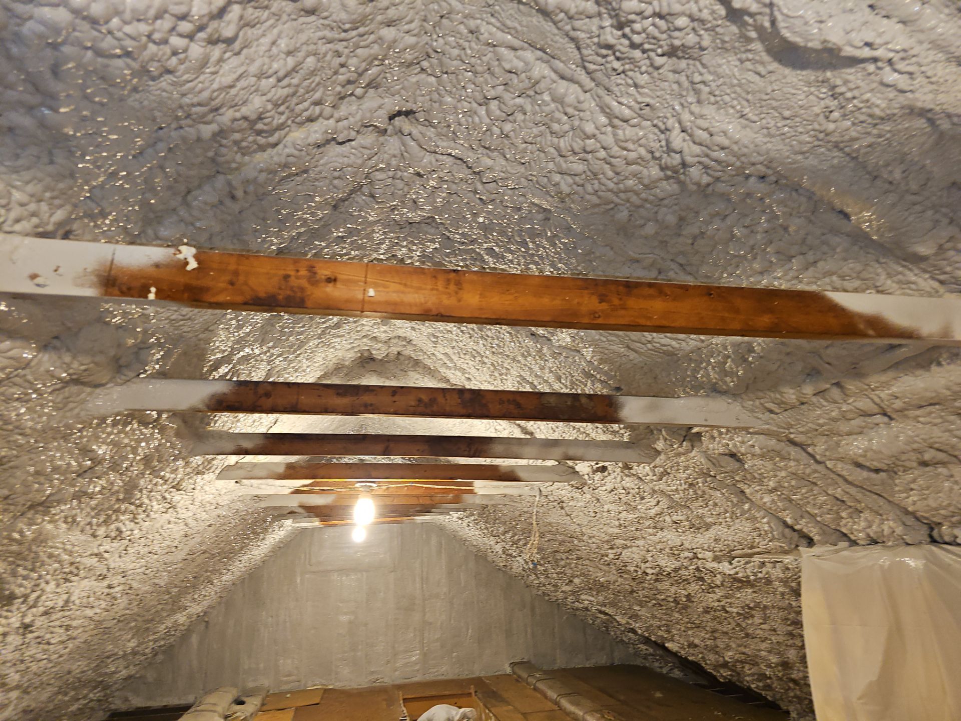 Attic Retrofit using open cell spray foam by NYS Foam & Energy