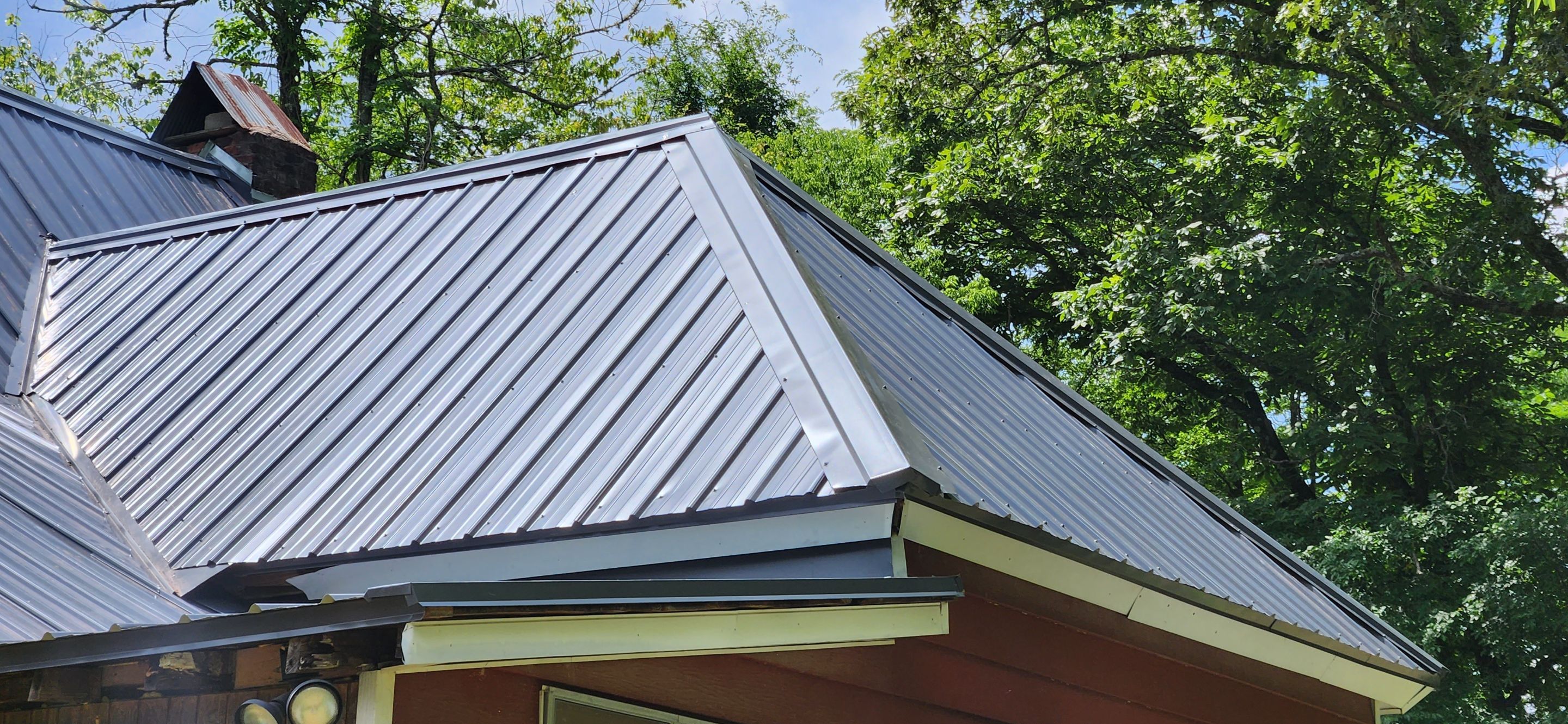 Residential Roofing Installation using 26 Gauge Colored Panels by Hostetler Roofing