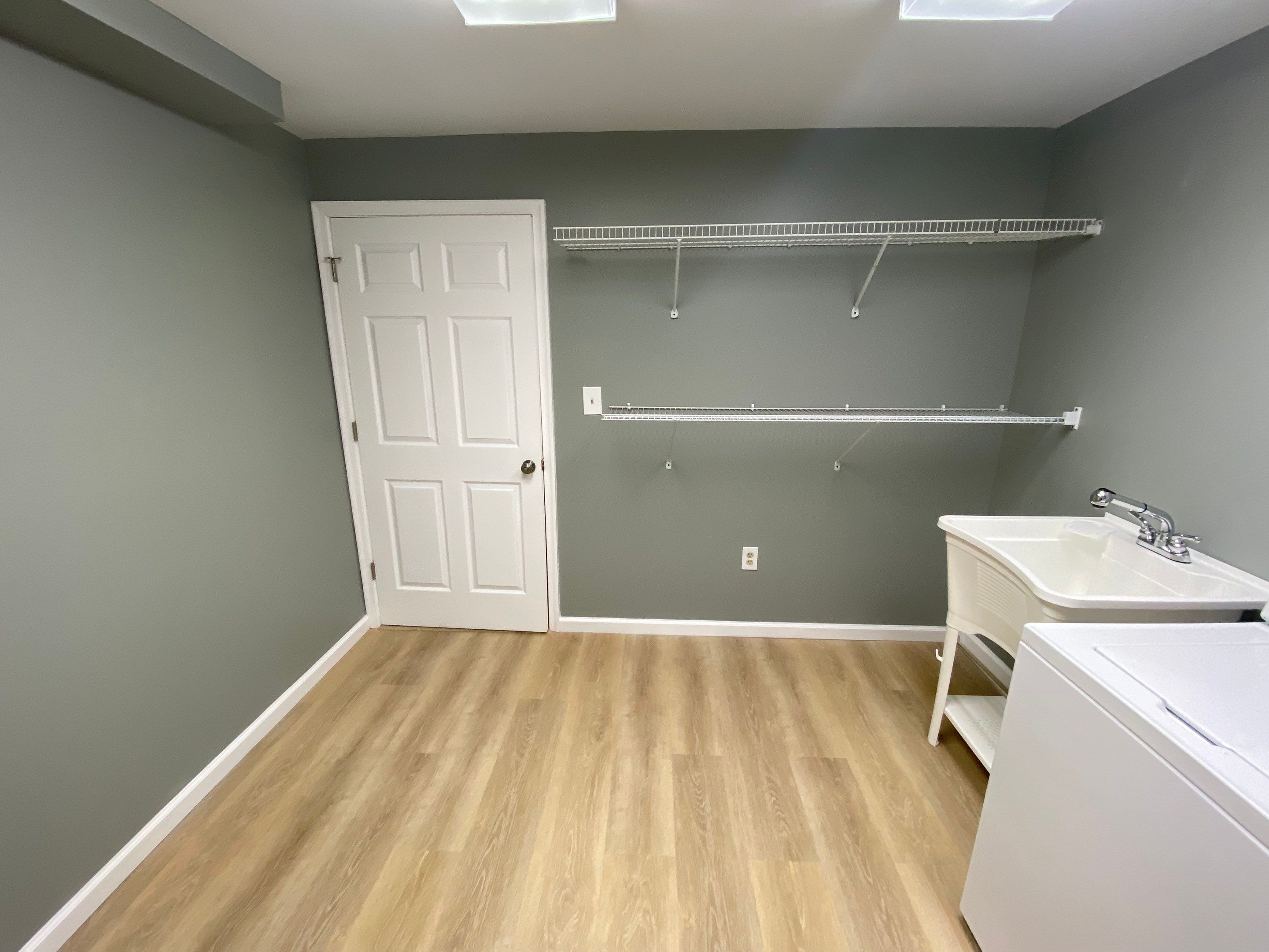 Laundry Room Redmodel using Lifeproof Luxury Vinyl Plank Flooring by The Smet Companies, LLC
