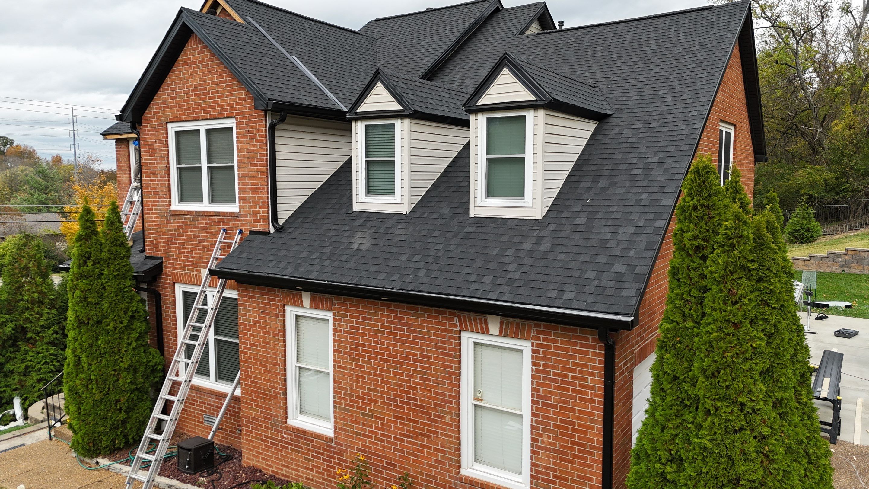 Charcoal Black Re-Roof & Gutters by Royal House LLC