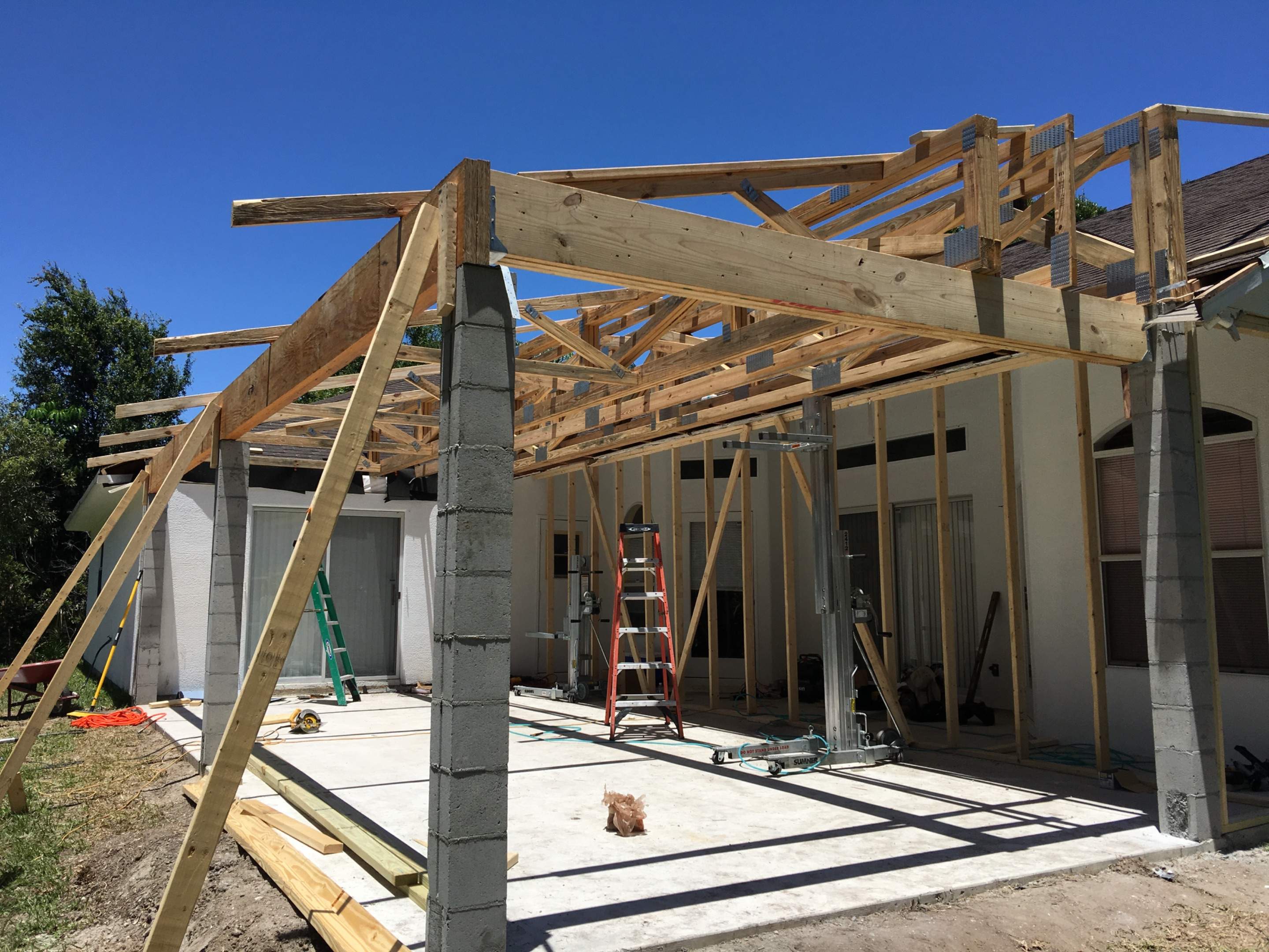 Covered Porch Extension and Structural Patio Addition in Melbourne by Florida Roofing and Renovations Inc.