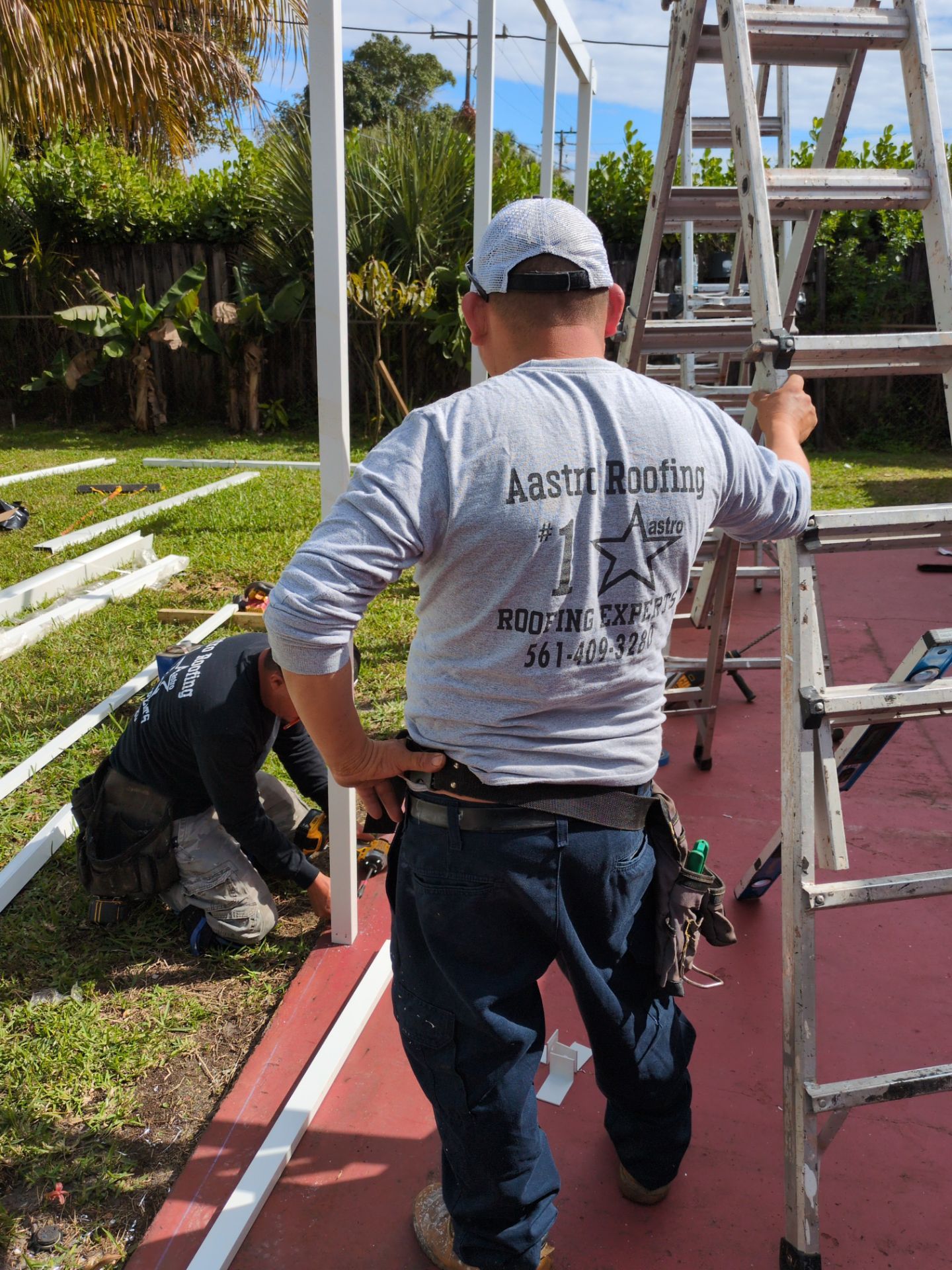 Insulated Screen Enclosure and Wood Tile Deck Installation in Plantation by Aastro Roofing