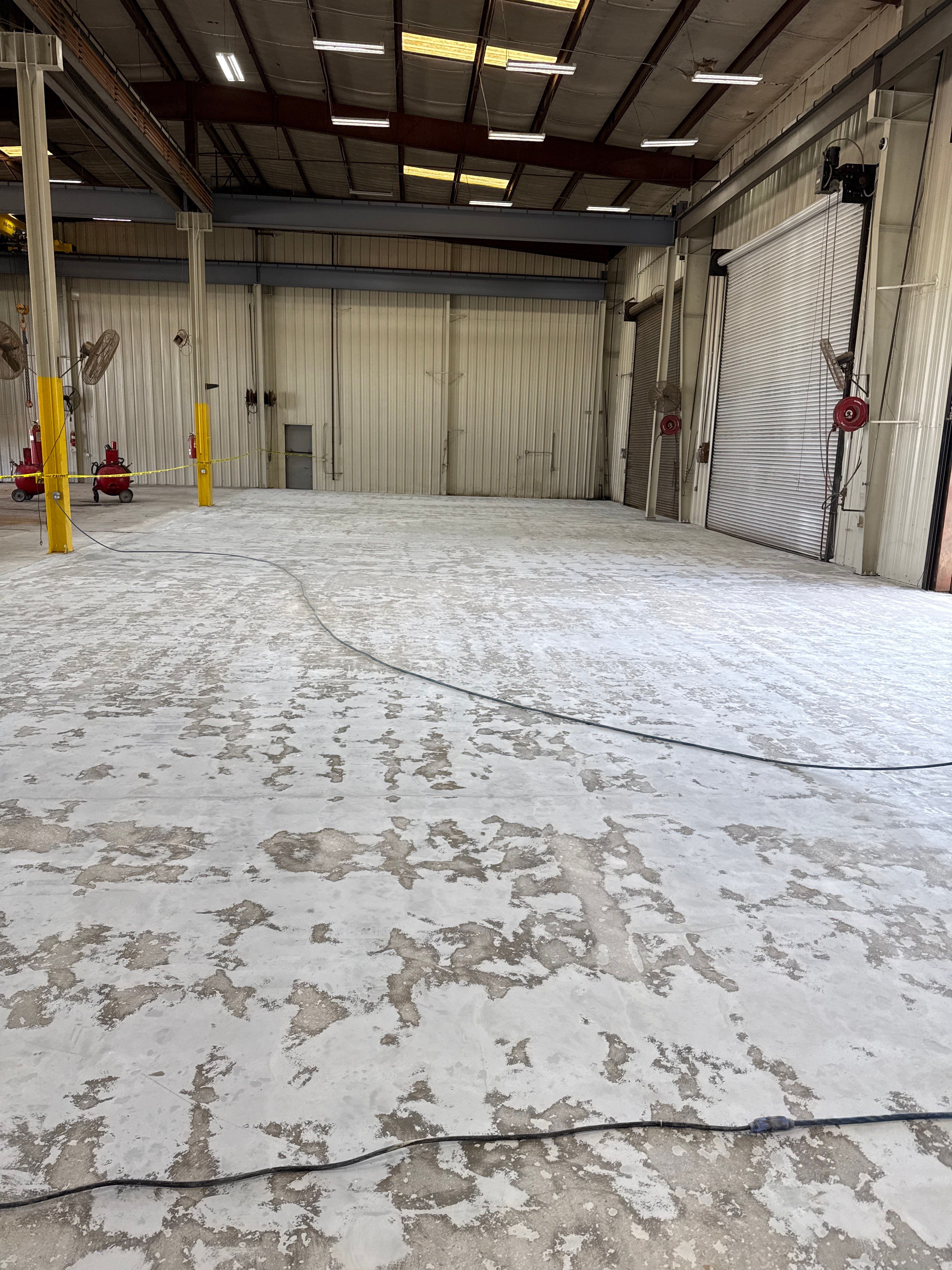 Industrial Epoxy Flooring for Heavy Equipment Work Bay in Mobile by Cornerstone Hard Surface Restoration