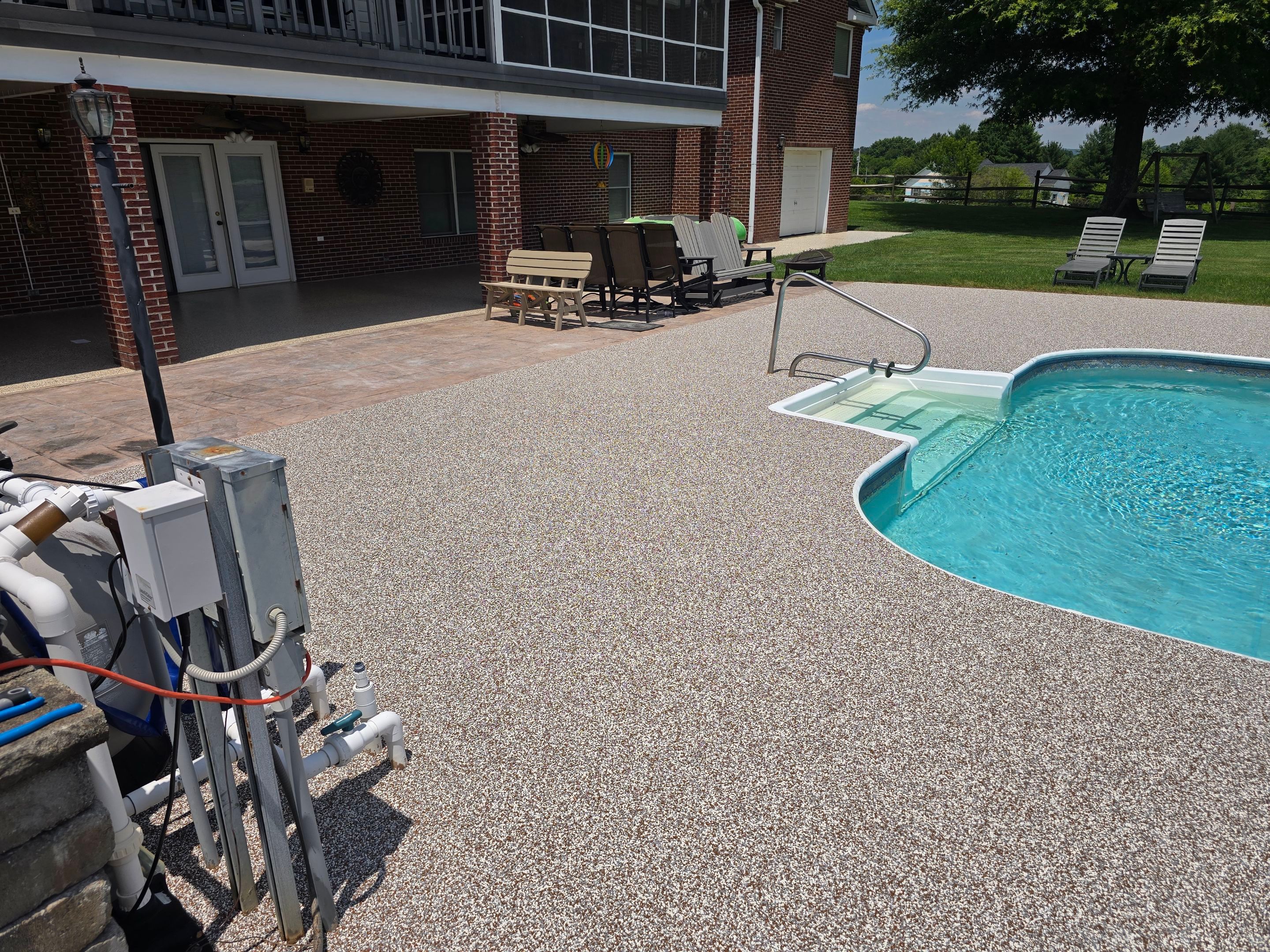 Pool Deck and Porch Using Brownstone and Coldwater Canyon by Elite Floor Solutions