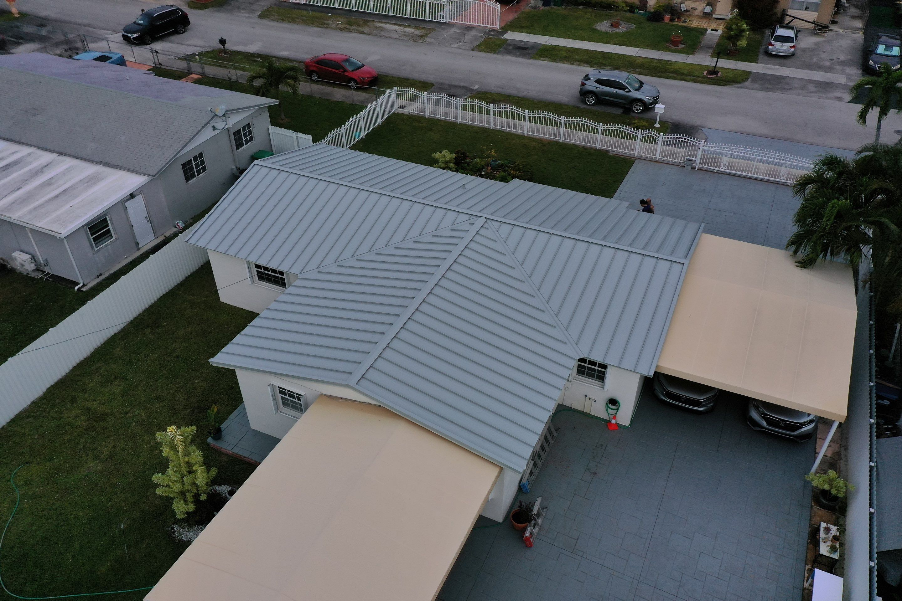 RESIDENTAL METAL REROOF 24 GUAGE DOVE GRAY 1-1/2" MECHANICAL SEAM METAL POLYGLASS POLYSTICK XFR by Earl W. Johnston Roofing 