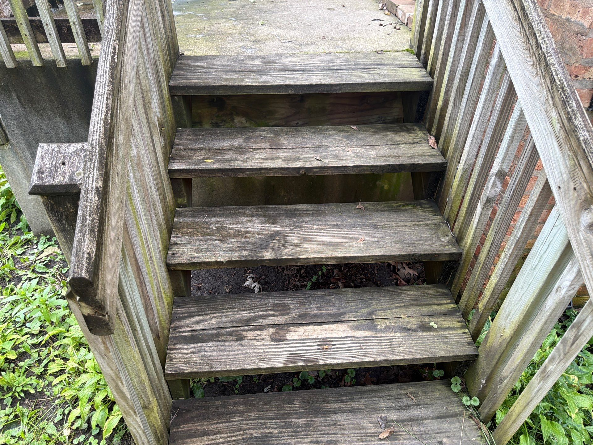 Wood fence cleaning and sealing by Northern Power Washing LLC.