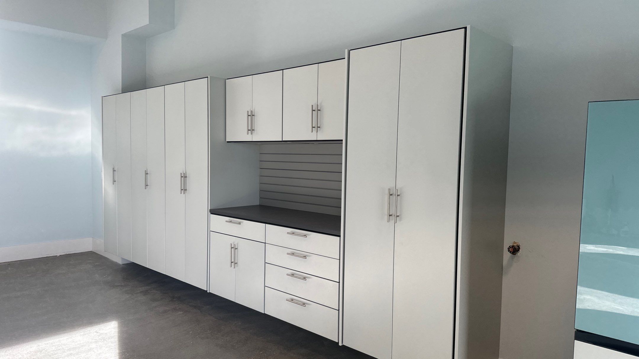 Bryon V. upgrades garage with cabinets and heavy duty slatwall by Banner Garage