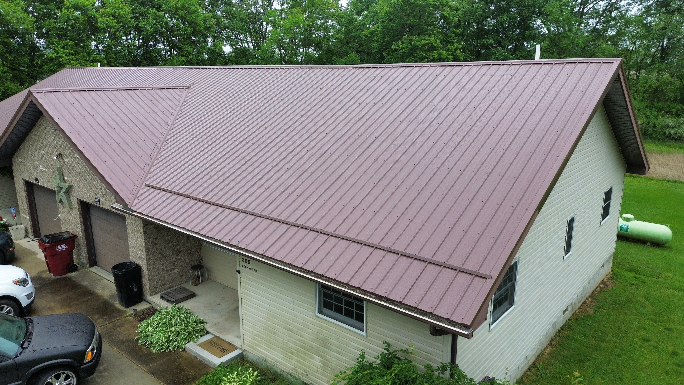 Residential Roofing Installation using Performance Panel Metal - Coca Brown by RoofX 