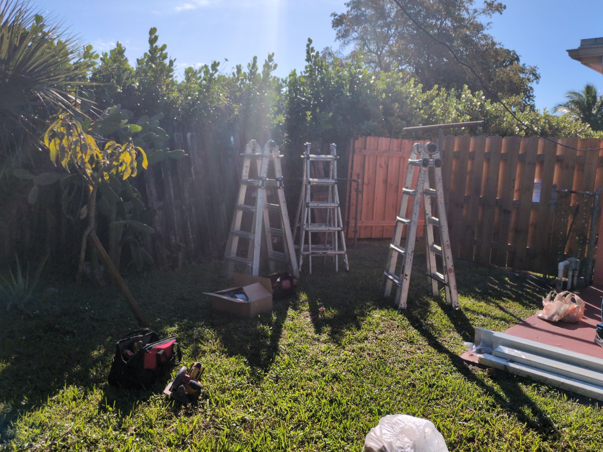Insulated Screen Enclosure and Wood Tile Deck Installation in Plantation by Aastro Roofing