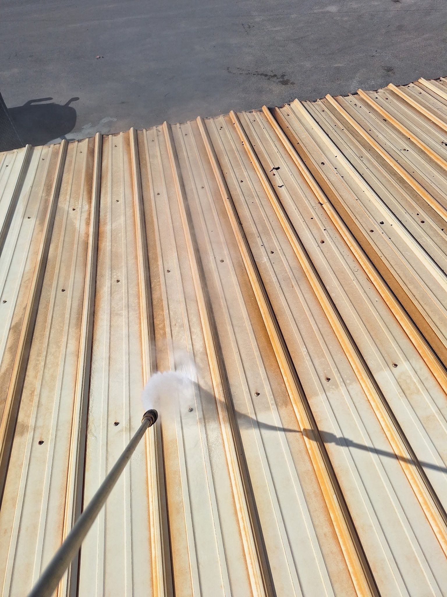 Commercial Metal Roof Restoration with White Protective Coating by Southern Roof Solutions