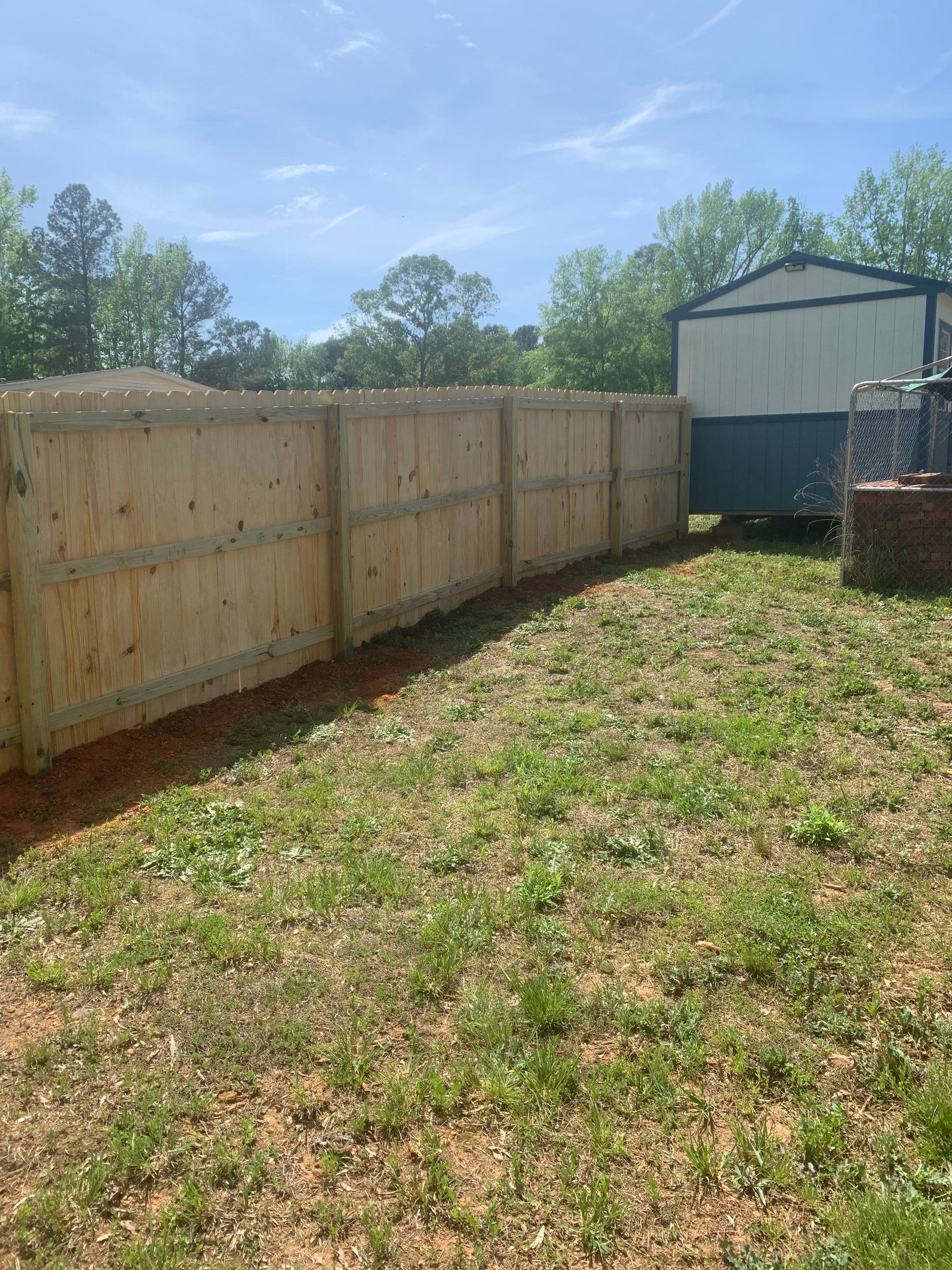 Stockade Wood Project in Roanoke Rapids by Superior Fence and Rail