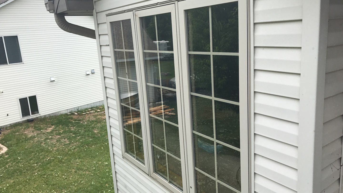 Storm Damage Restoration using Atlas Pinnacle Shingles and Mastic Vinyl Siding  by MODERN EXTERIOR SYSTEMS