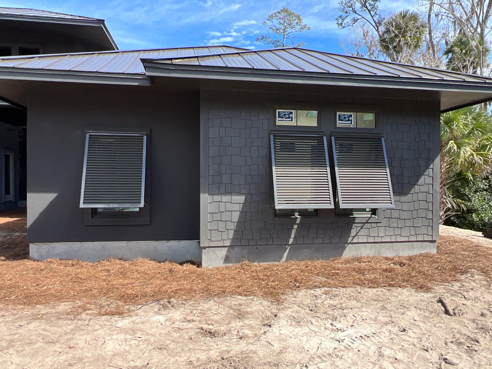 Bahama Shutters in Umbra Grey by Smart Guard Shutters