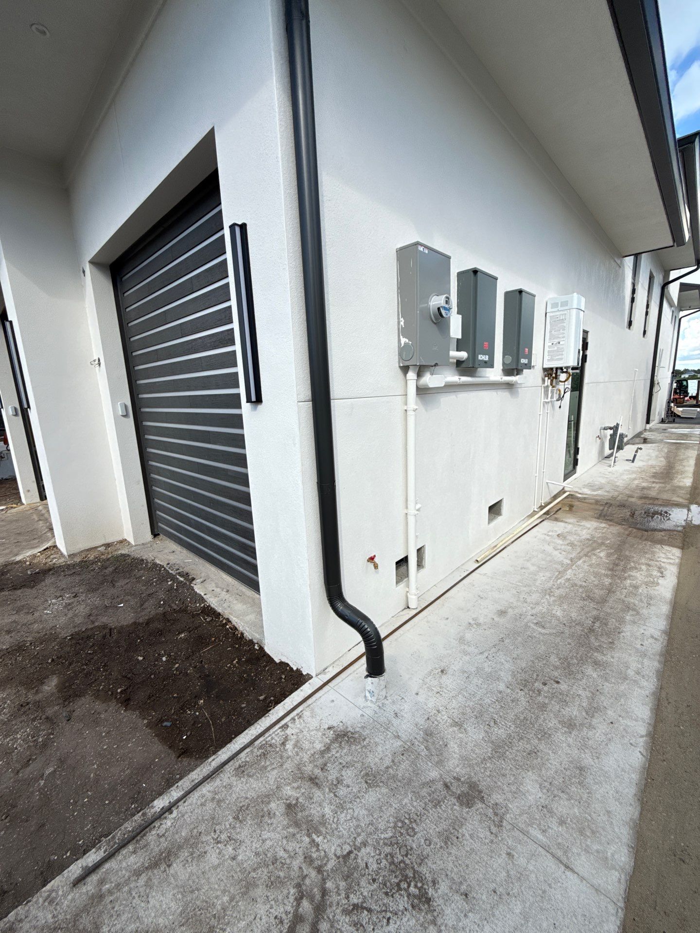 Seamless Aluminum Gutter Installation using black seamless gutters in Sarasota FL by Gutter Professors