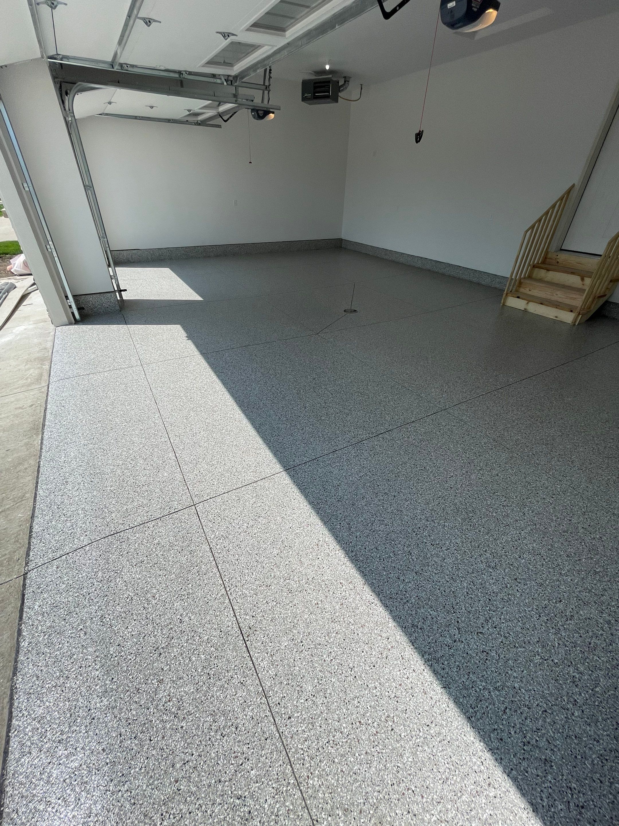 Grey Speckled Garage Floor Coating in Sioux Falls by Select Painting, Coatings & Garage Cabinets