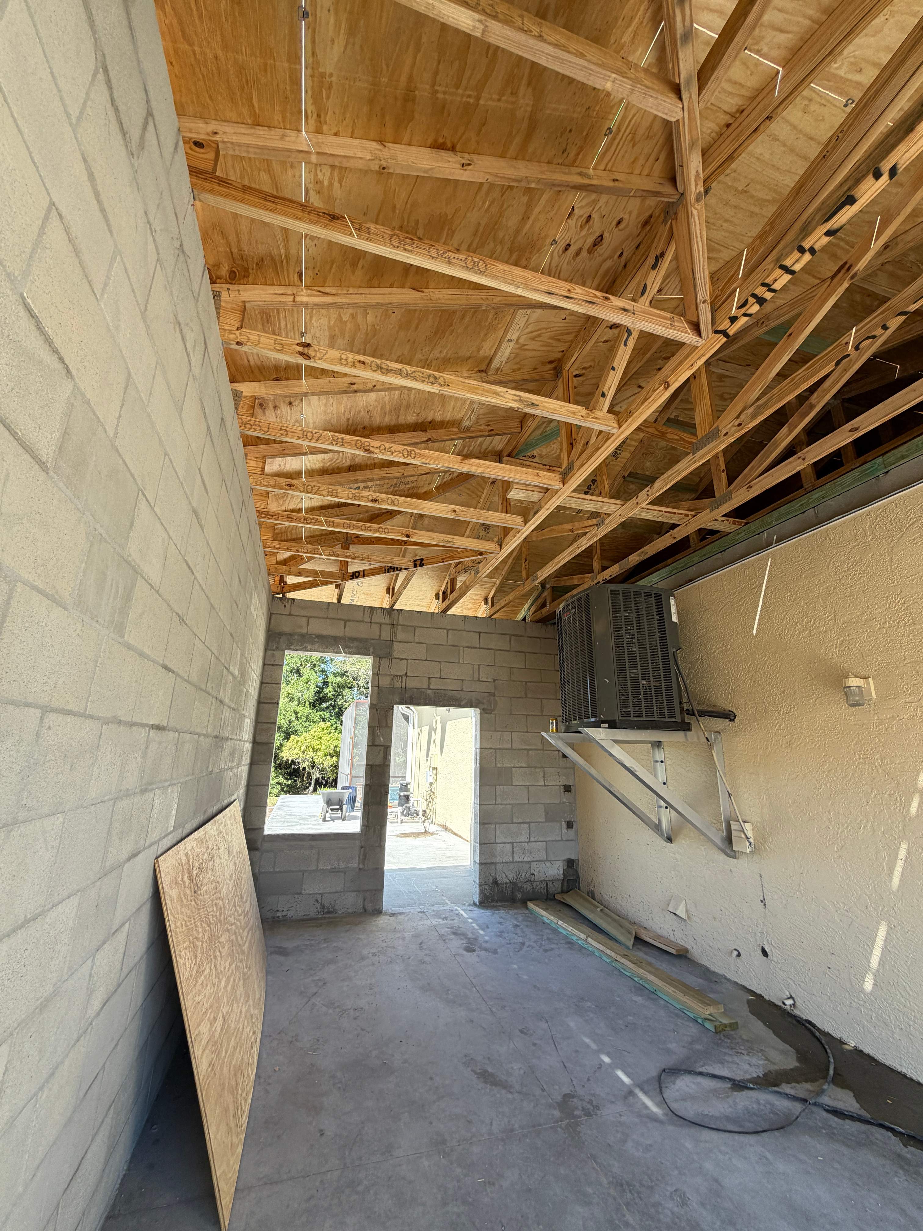 Custom Single-Car Garage Addition and Lanai Cage in Bradenton by Vertical General Contracting 