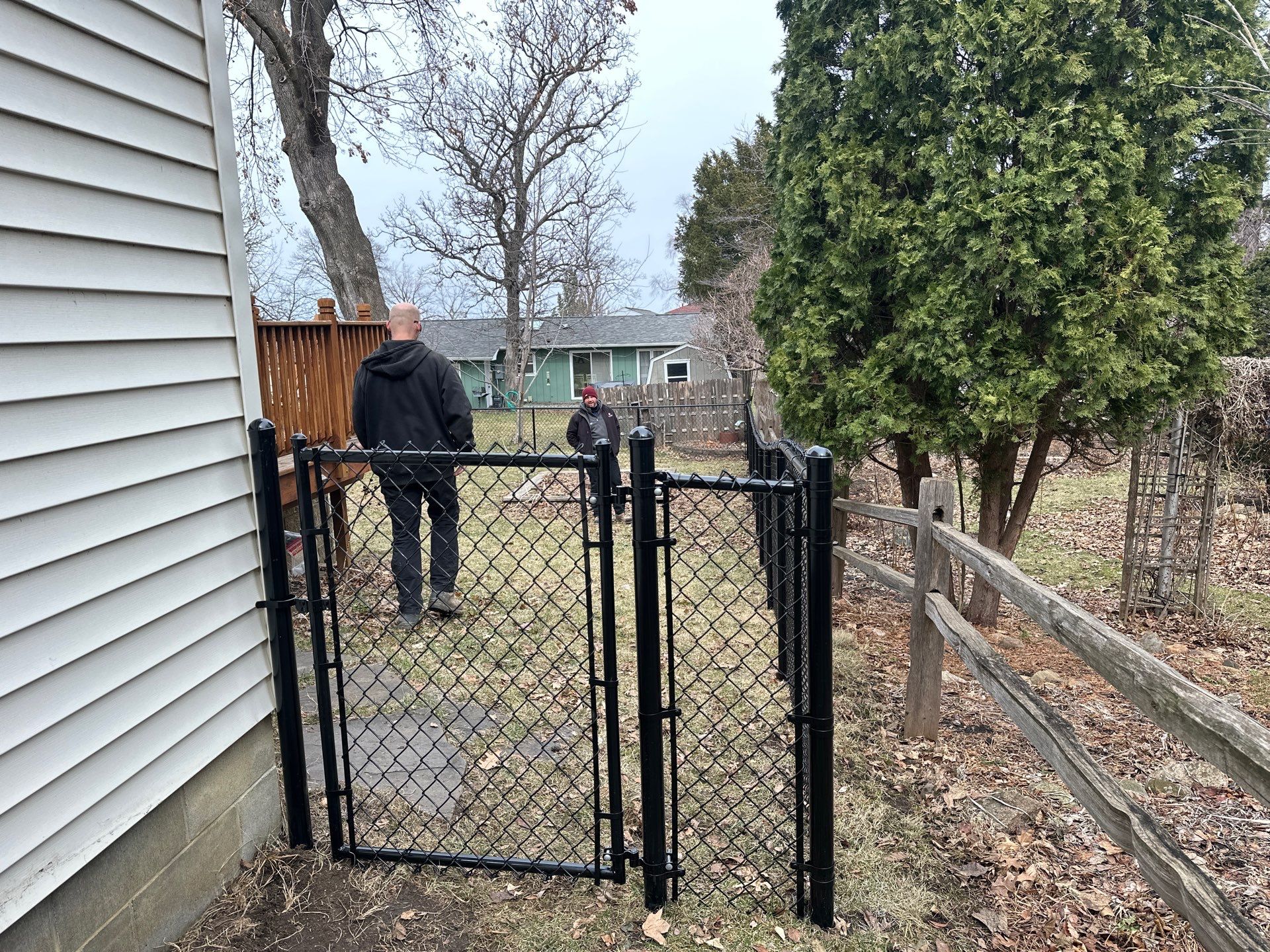 Black Vinyl Chain Link Fence Installation in Cedar Falls by Perfect Picket Fence and Stain