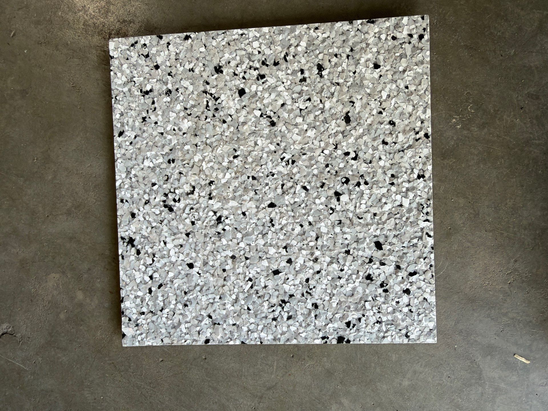 Residential Garage Floor Coating with Feather Grey Finish in Sioux Falls by Select Painting, Coatings & Garage Cabinets