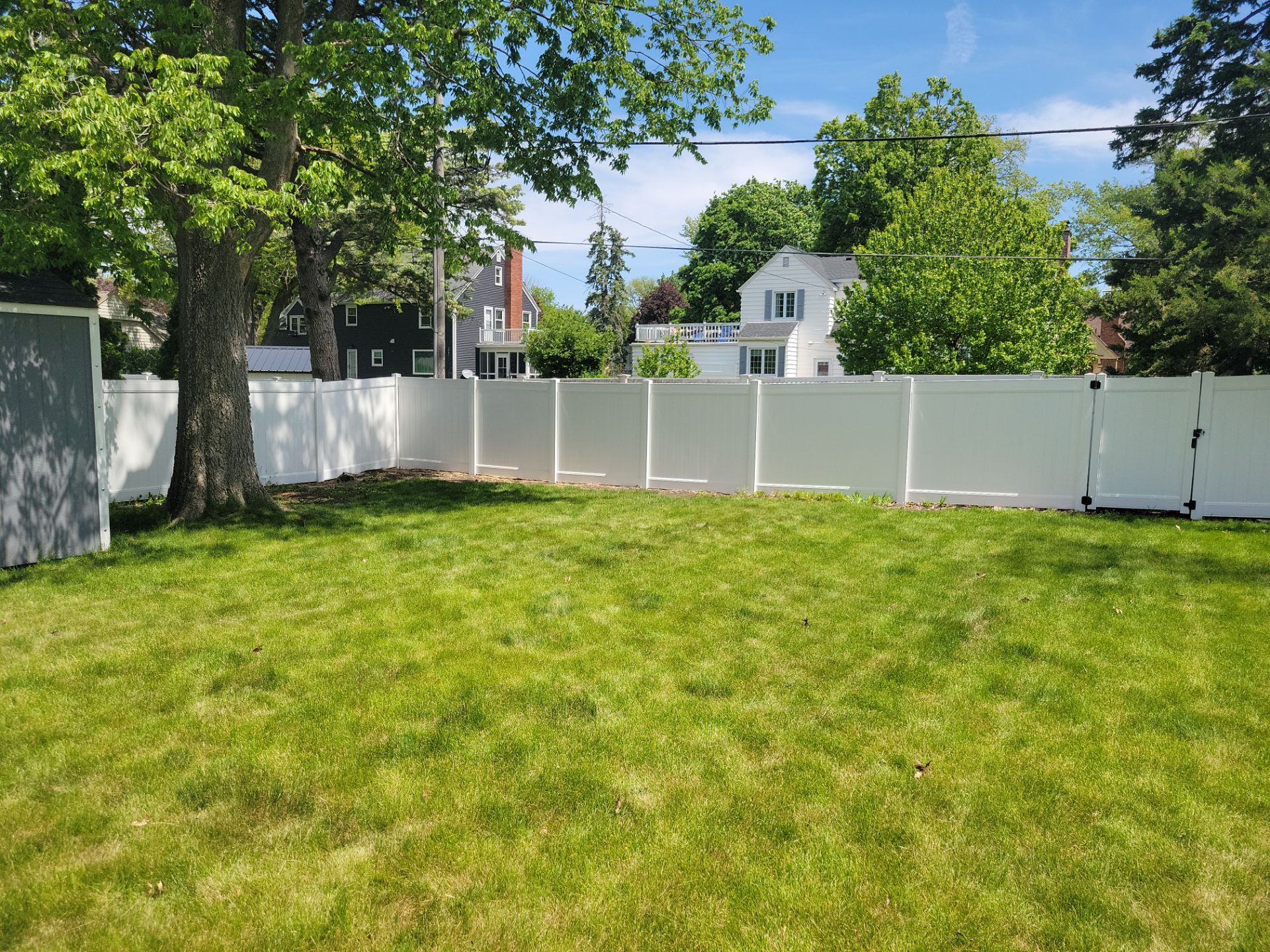 Residential White Vinyl Privacy Fence Installation in Waterloo by Perfect Picket Fence and Stain