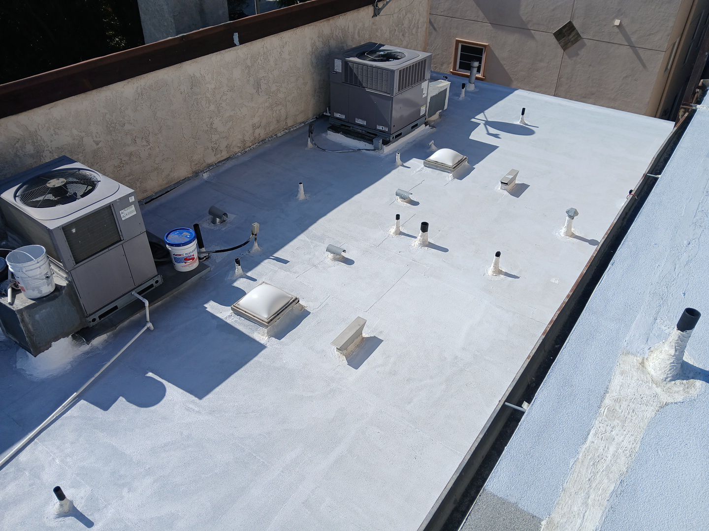 Apartment Building Silicone Coating by Hull Brothers Roofing
