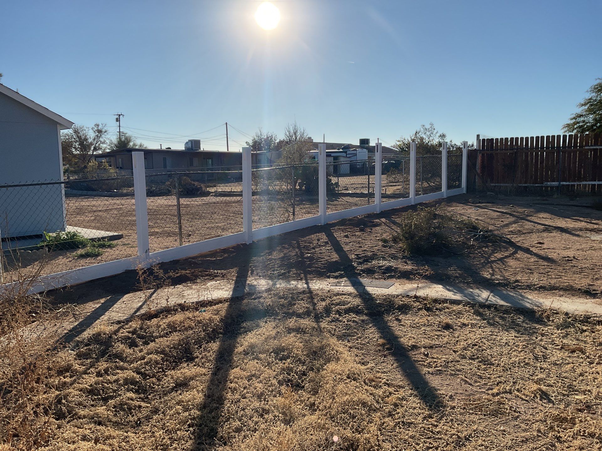 Fence Installation using vinyl and chain link  by Fence Guys Inc. 